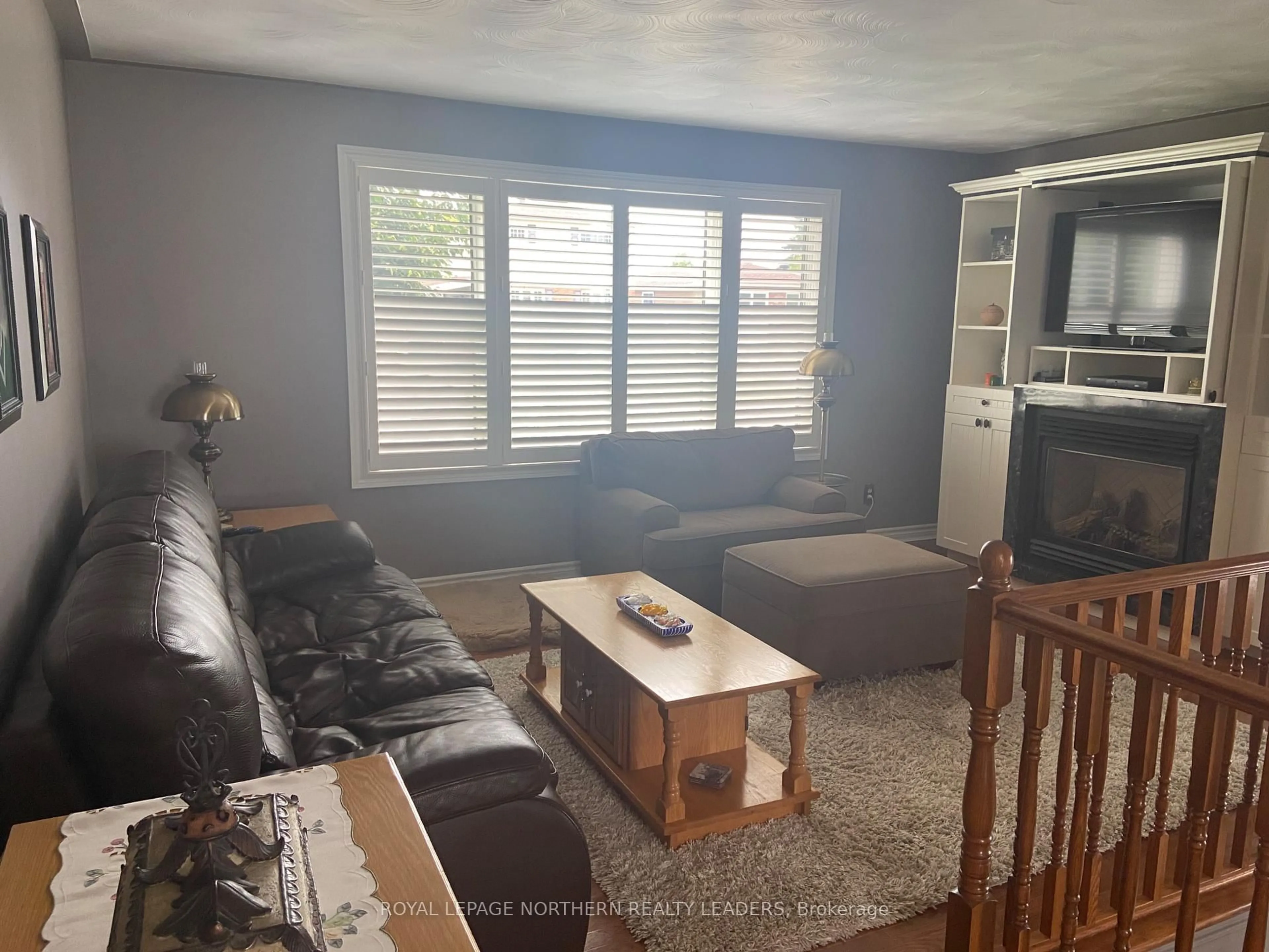 Living room with furniture, wood/laminate floor for 272 Malette Cres, Timmins Ontario P4P 1C5
