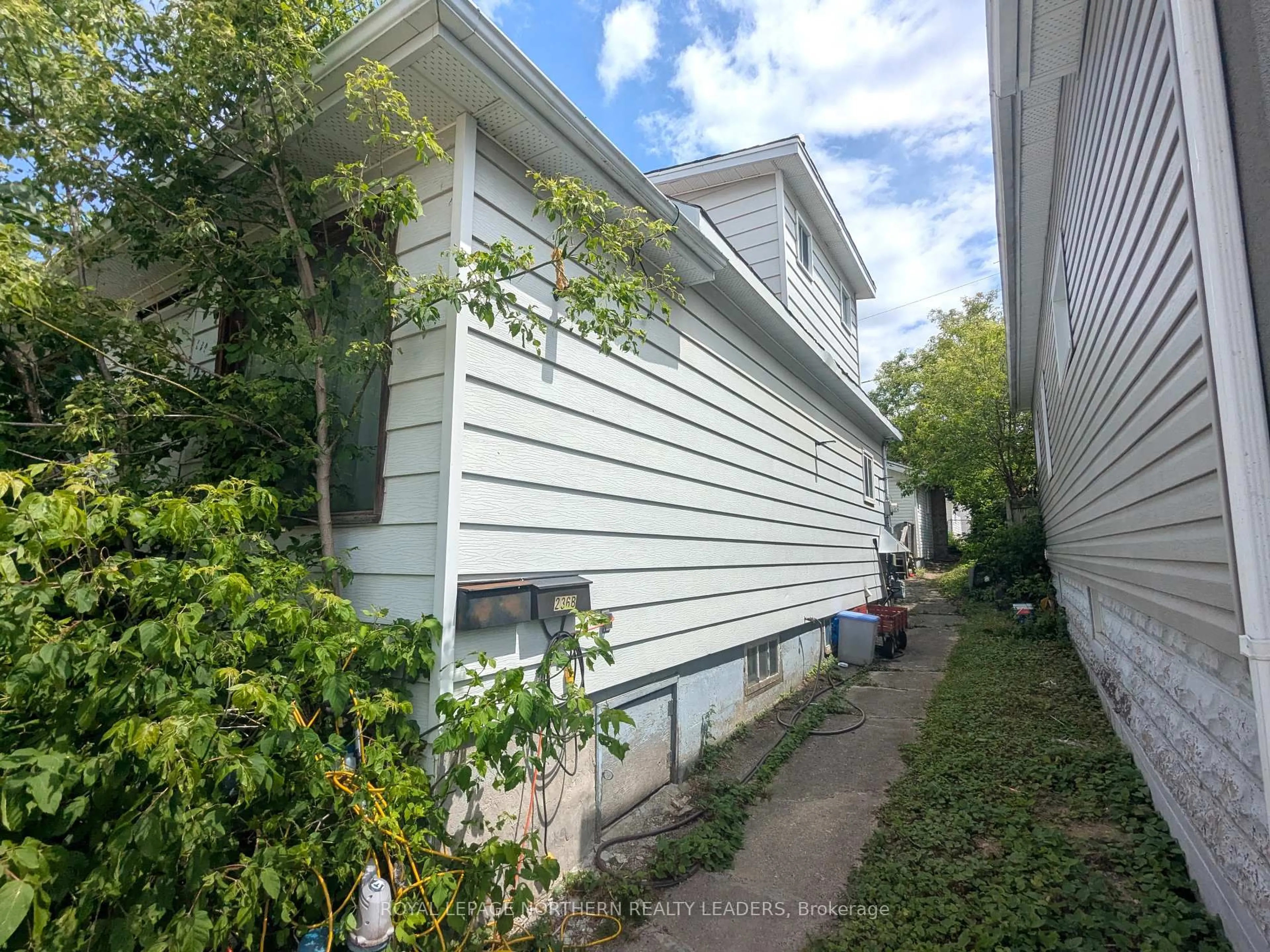 Home with vinyl exterior material, street for 236 Tamarack St, Timmins Ontario P4N 6R1