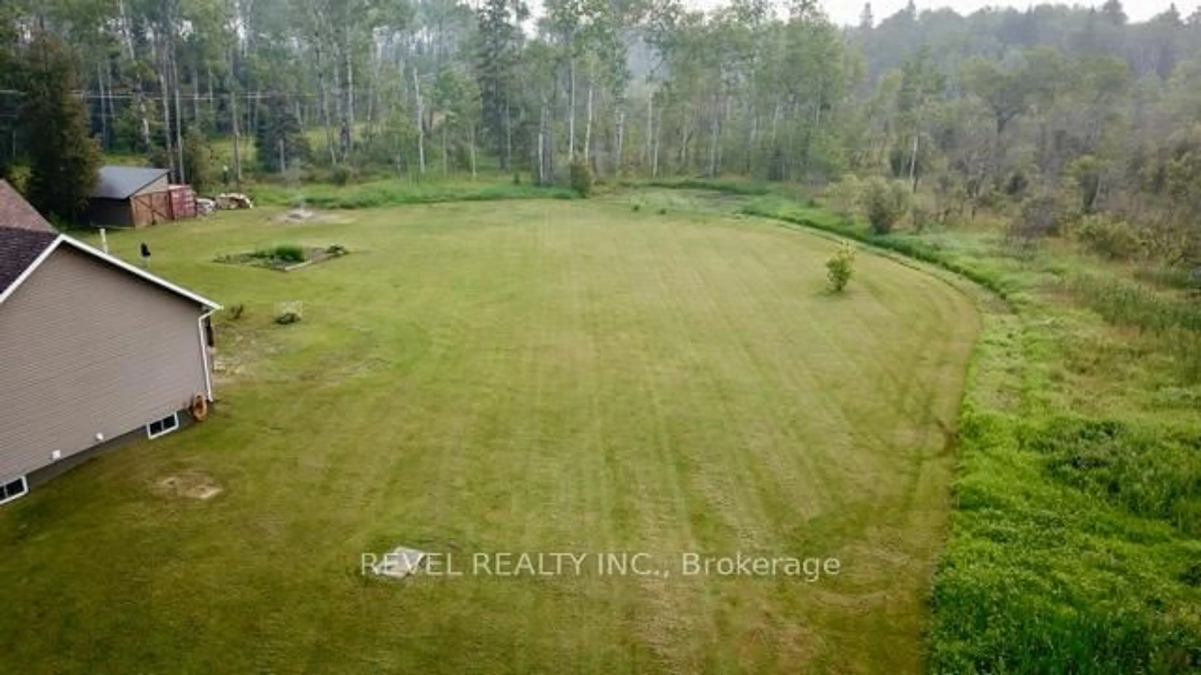 A pic from outside/outdoor area/front of a property/back of a property/a pic from drone, forest/trees view for 170 Garden Rd, Timmins Ontario P4R 0B1