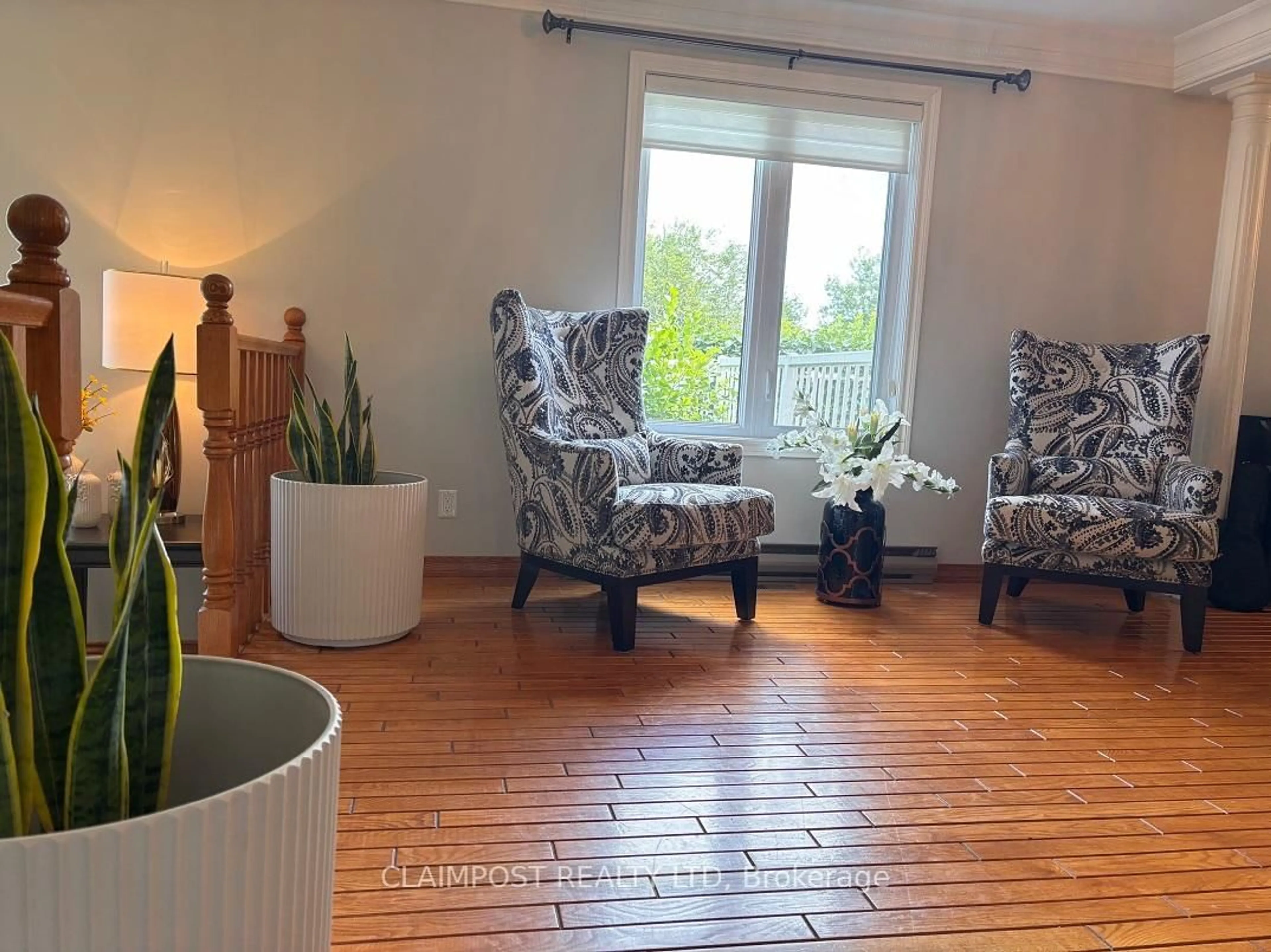 Living room with furniture, wood/laminate floor for 304 Cameron St, Timmins Ontario P4N 8L4