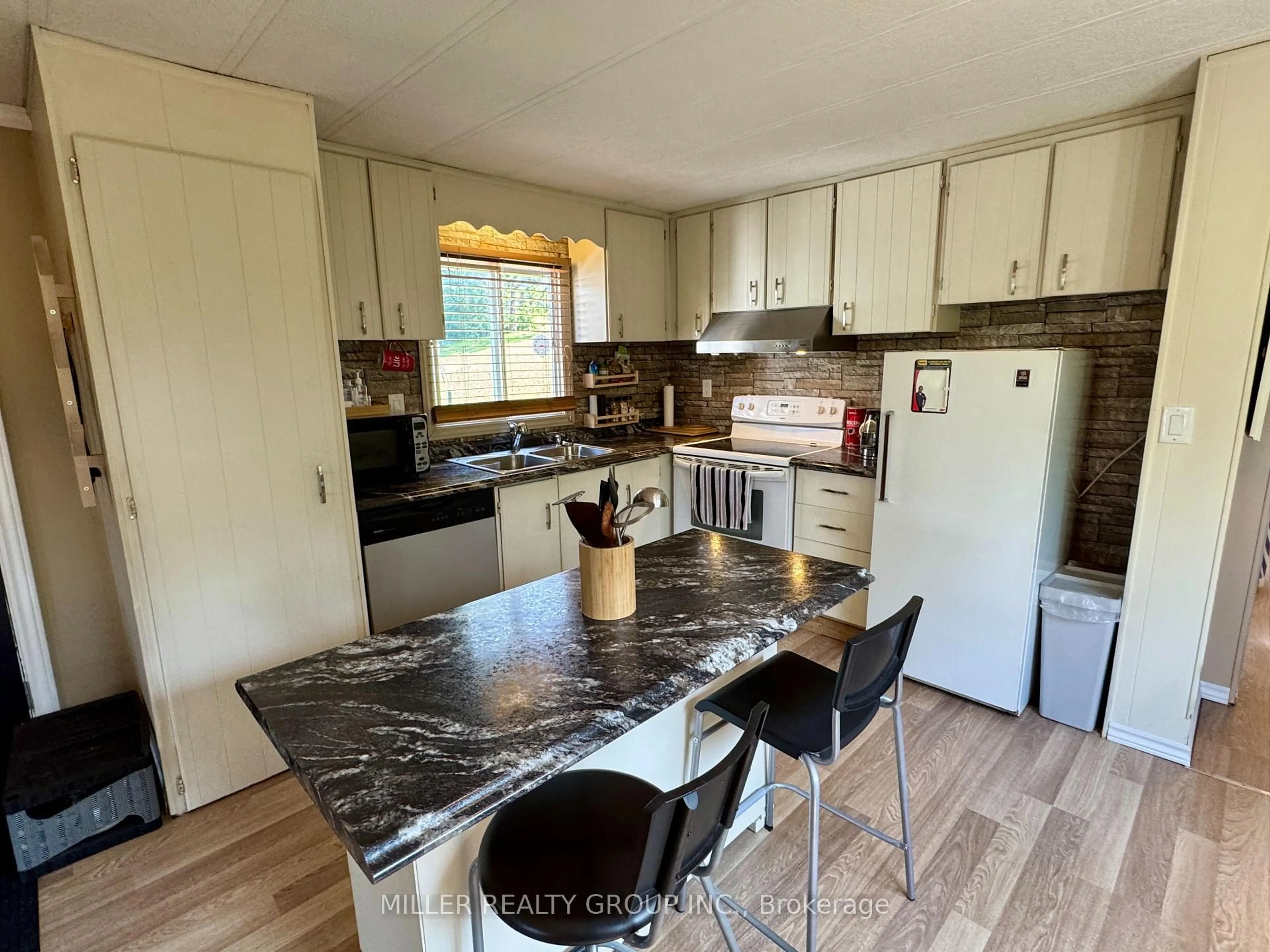 Open concept kitchen, wood/laminate floor for 51 Main St, Timiskaming Ontario P0J 1N0