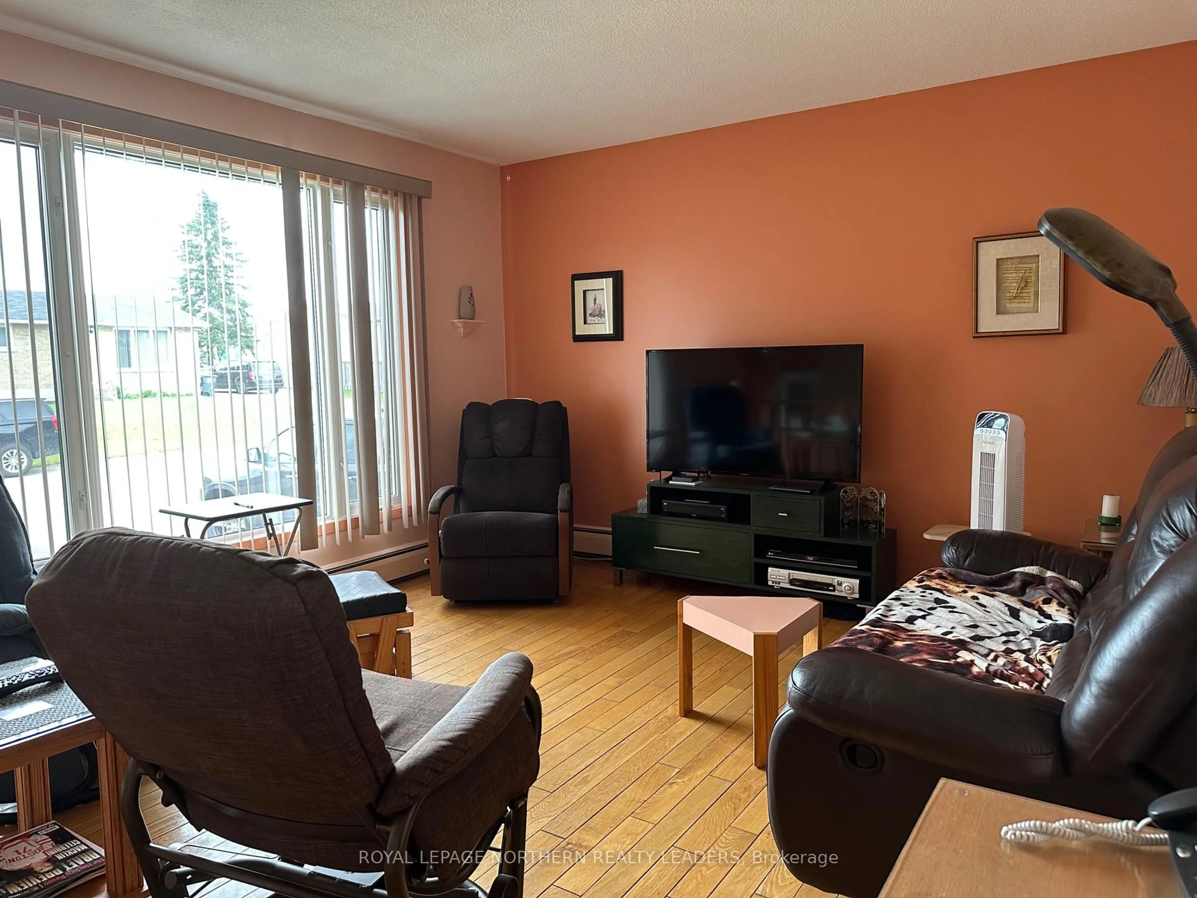 Living room with furniture, wood/laminate floor for 88 Pine Ave, Smooth Rock Falls Ontario P0L 2B0