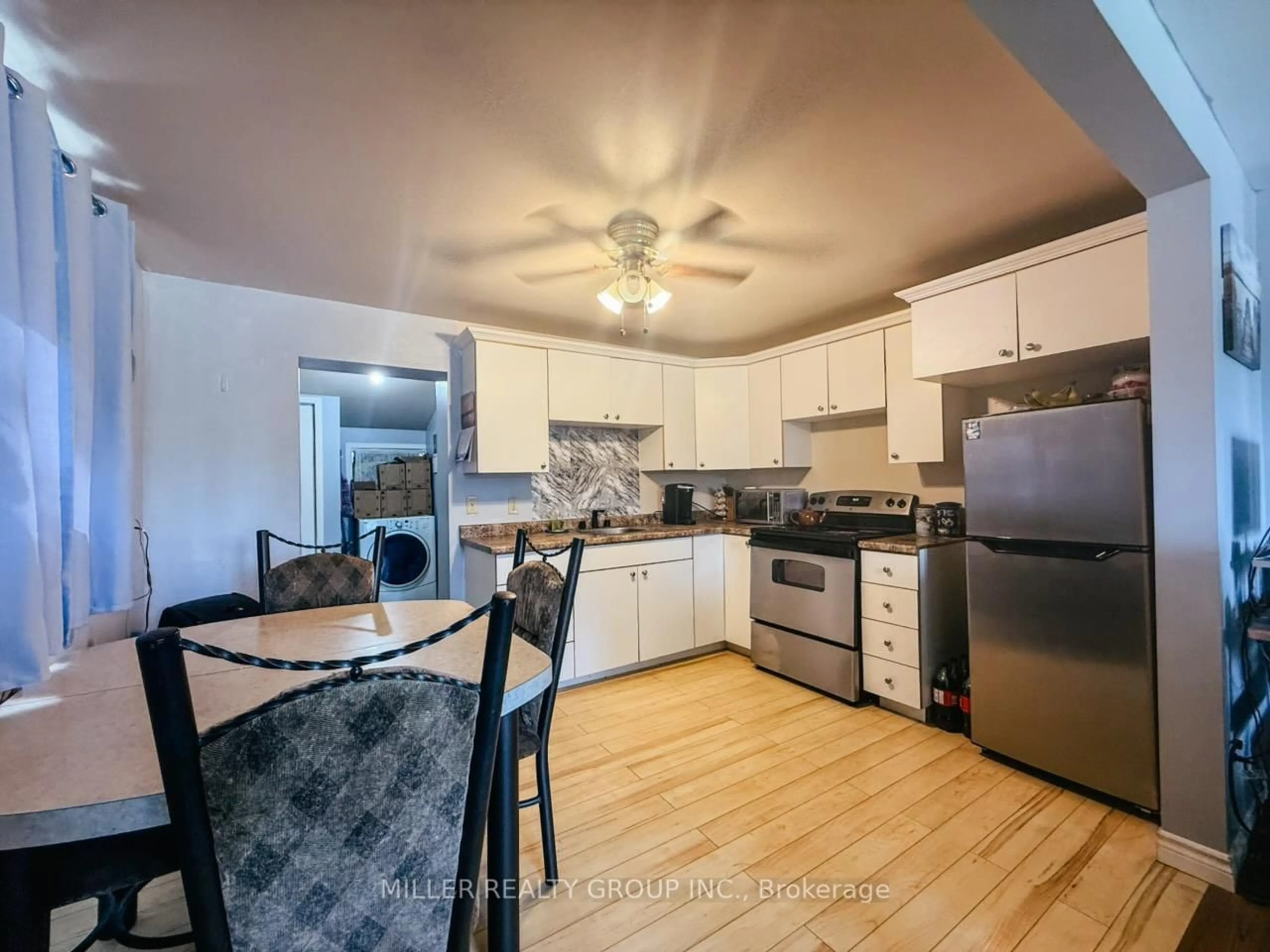 Open concept kitchen, wood/laminate floor for 13 Haliburton Ave, Temiskaming Shores Ontario P0J 1P0