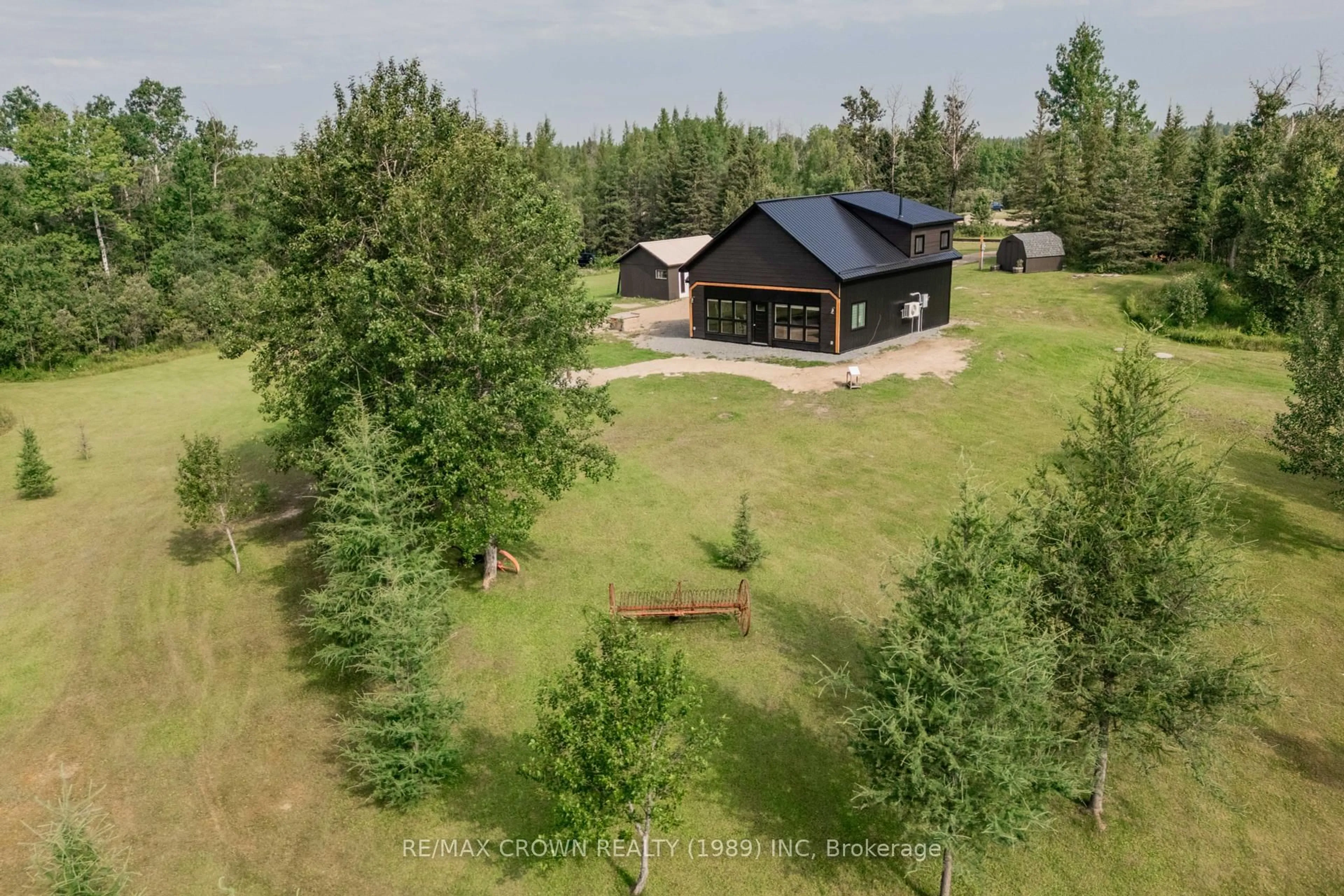 A pic from outside/outdoor area/front of a property/back of a property/a pic from drone, forest/trees view for 165 Highway 11, Kapuskasing Ontario P5N 2G0