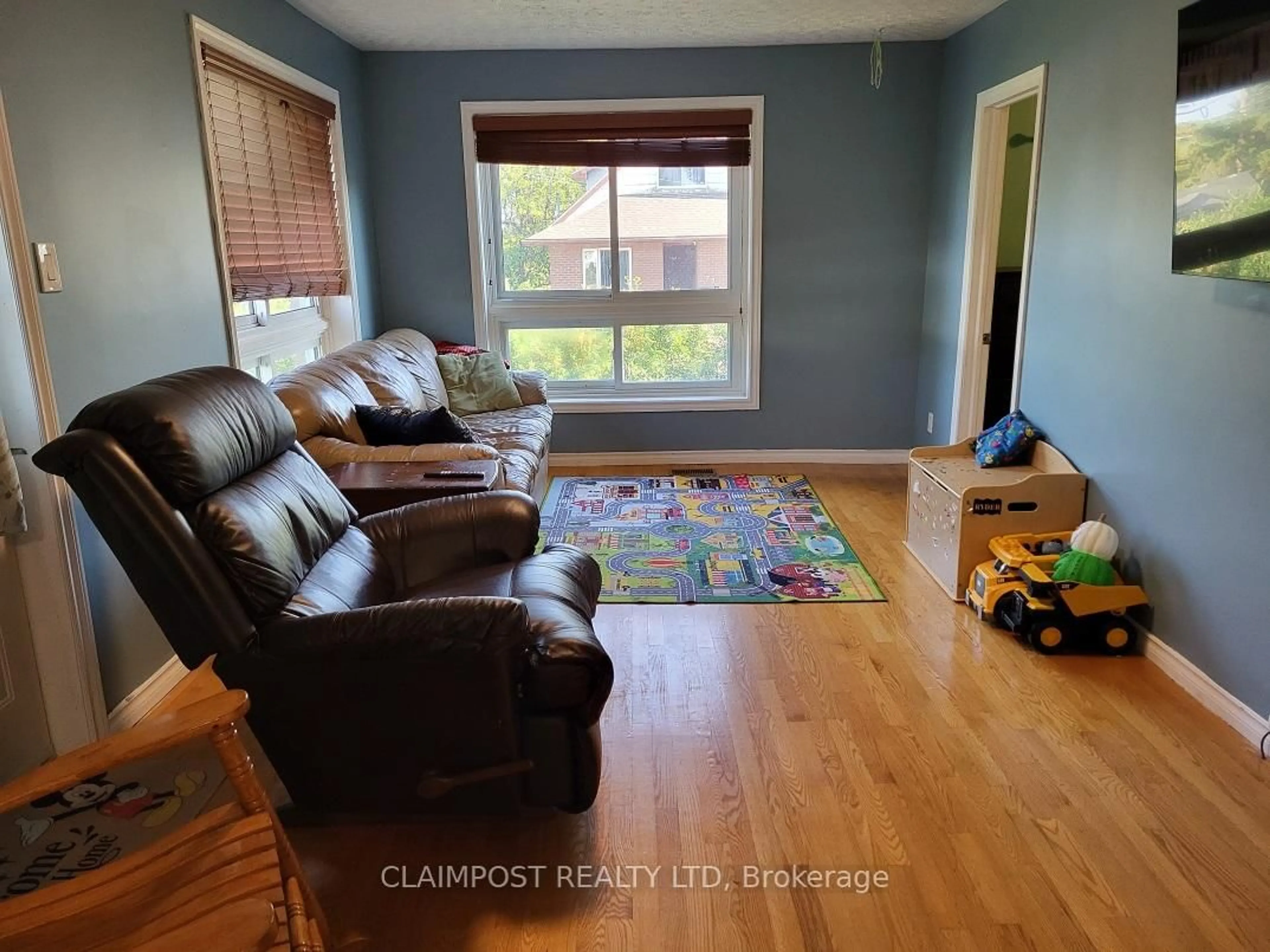 Living room with furniture, wood/laminate floor for 188 Wilcox St, Timmins Ontario P4N 3L3