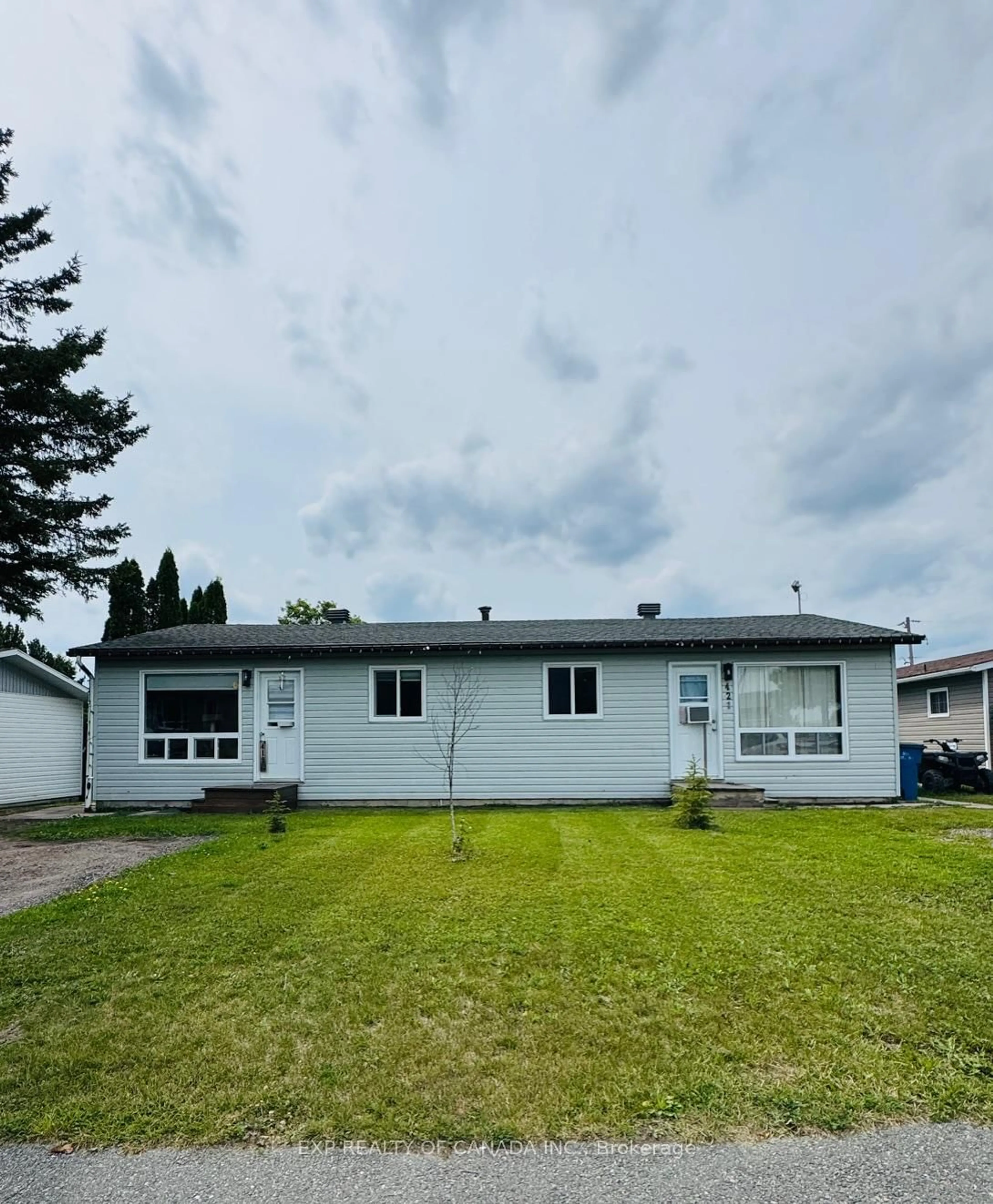 Home with vinyl exterior material, street for 419-421 Sixteenth Ave, Cochrane Ontario P0L 1C0