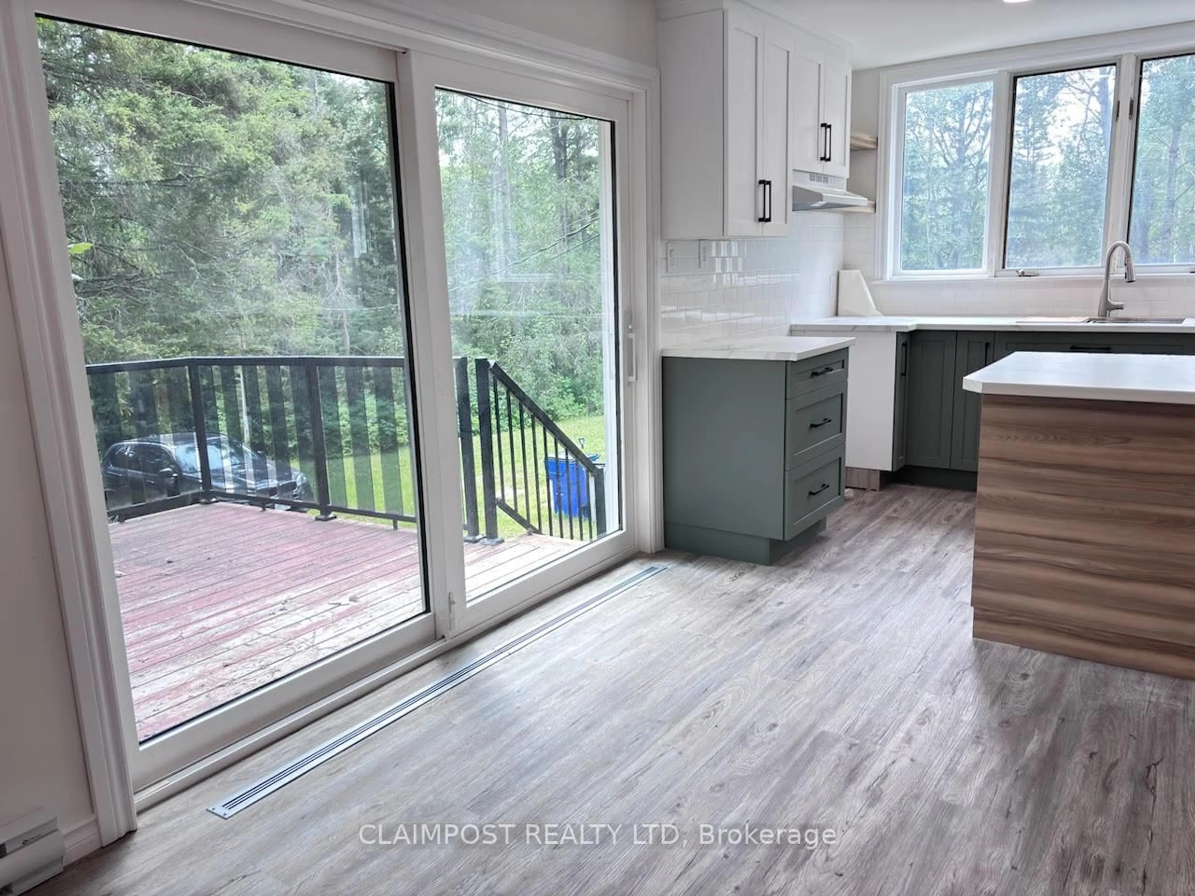 Open concept kitchen, wood/laminate floor for 38 Bluejay Lane, Timmins Ontario P4N 7C2
