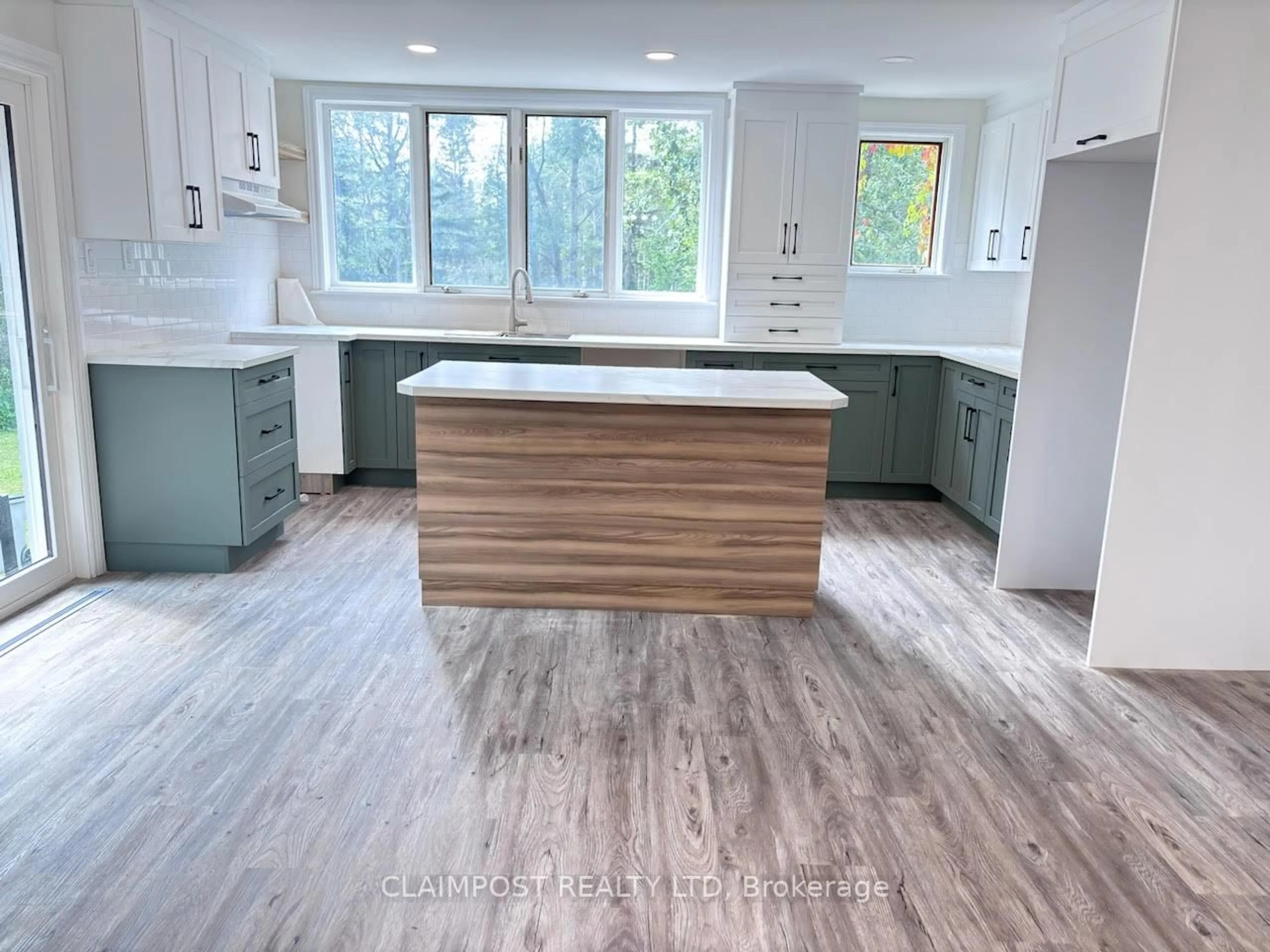 Open concept kitchen, wood/laminate floor for 38 Bluejay Lane, Timmins Ontario P4N 7C2