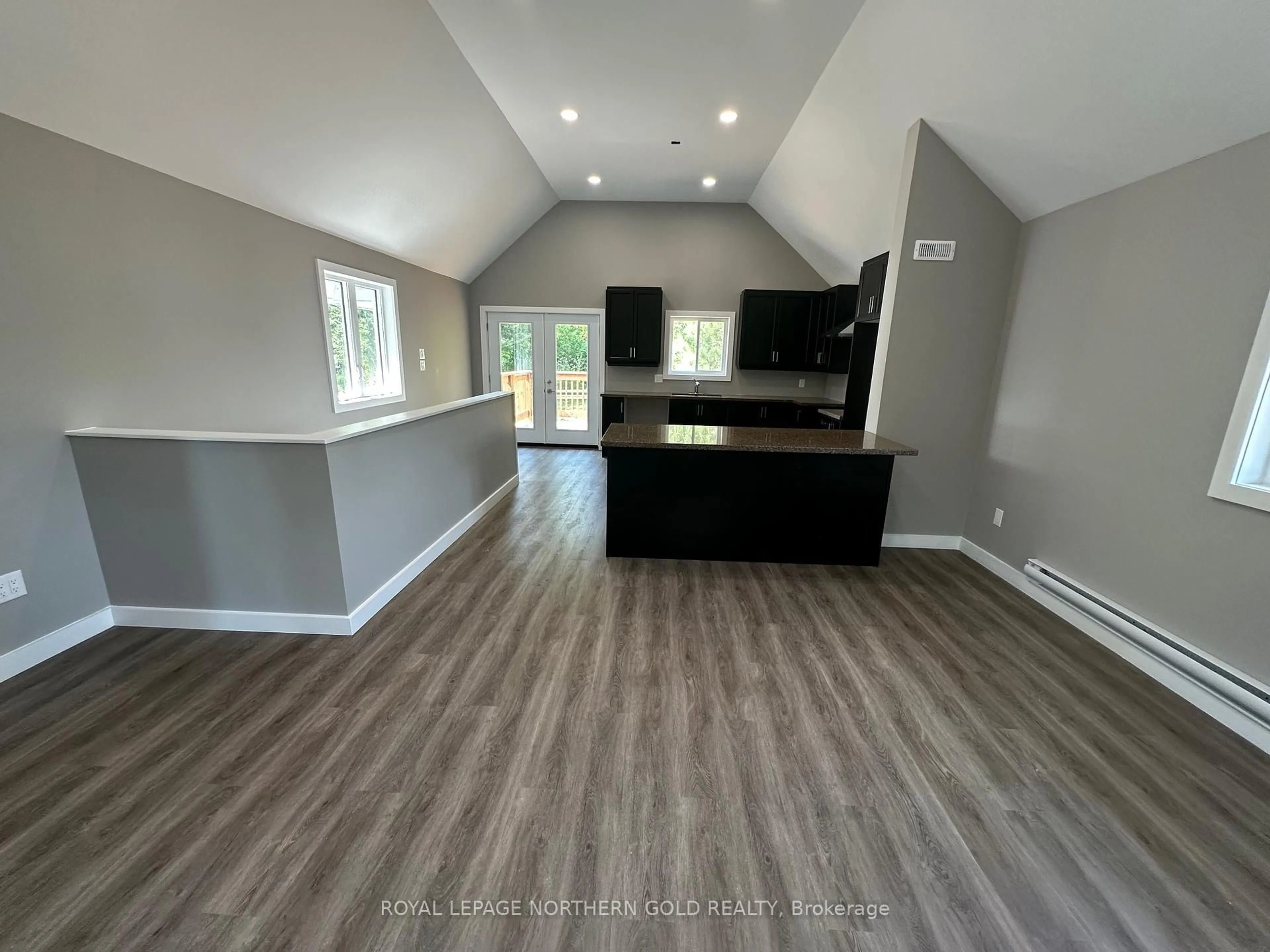 Open concept kitchen, wood/laminate floor for 740 Government Rd, Kirkland Lake Ontario P0K 1A0