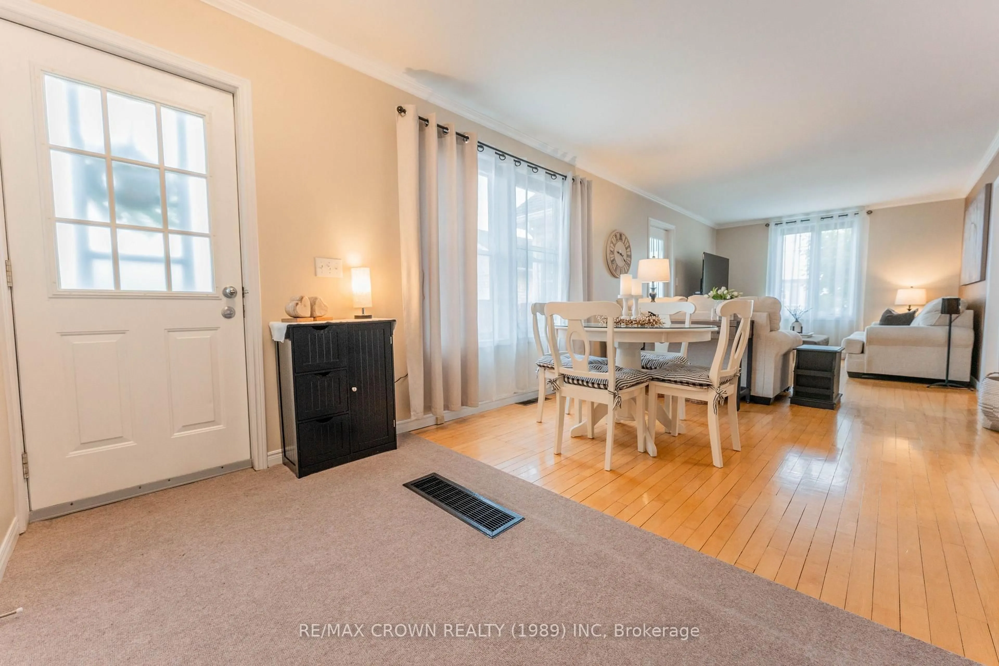 Living room with furniture, wood/laminate floor for 3 Ash St, Kapuskasing Ontario P5N 2C7