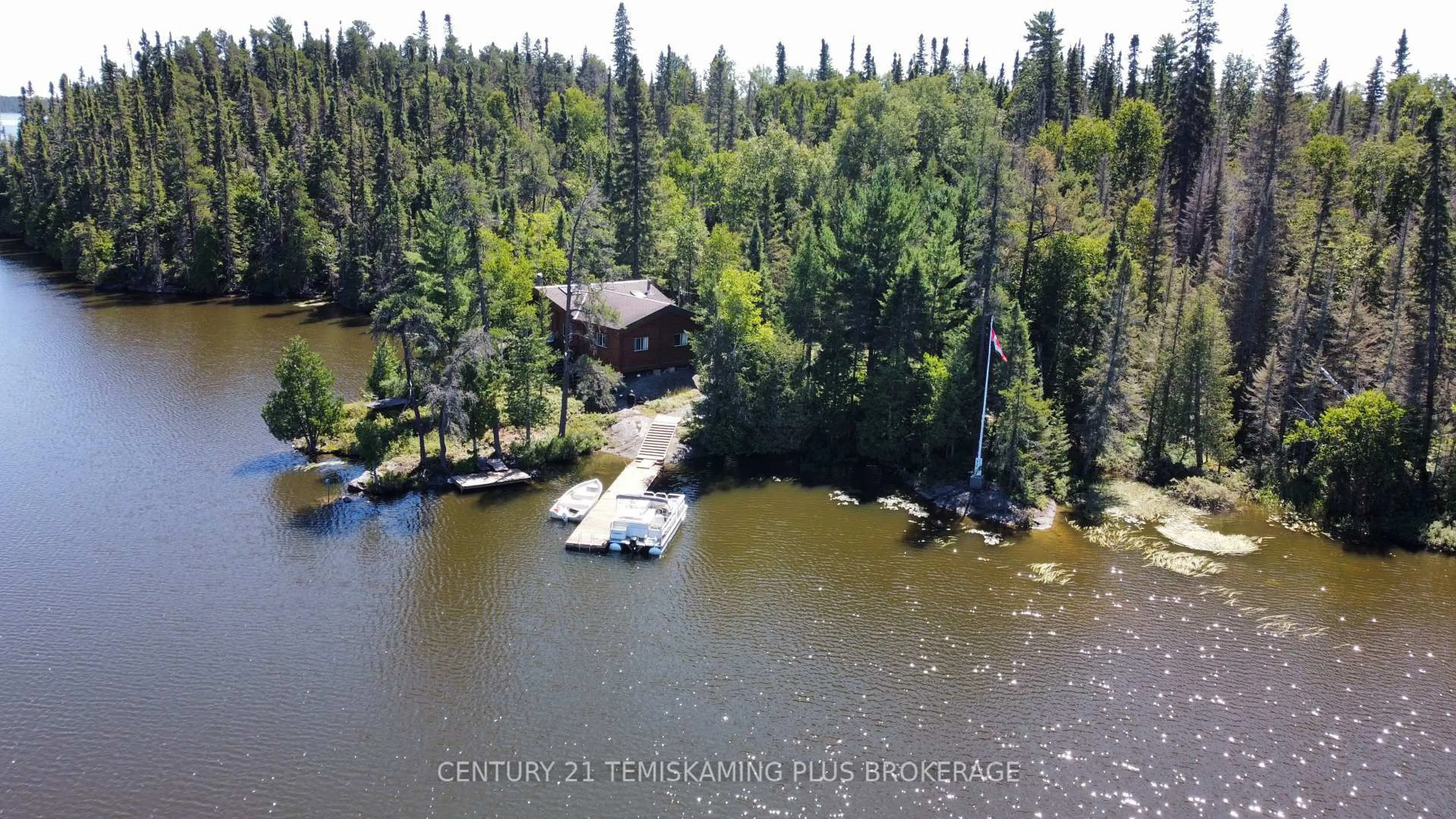 A pic from outside/outdoor area/front of a property/back of a property/a pic from drone, water/lake/river/ocean view for 29 Island A2, Timiskaming Ontario P0K 1S0