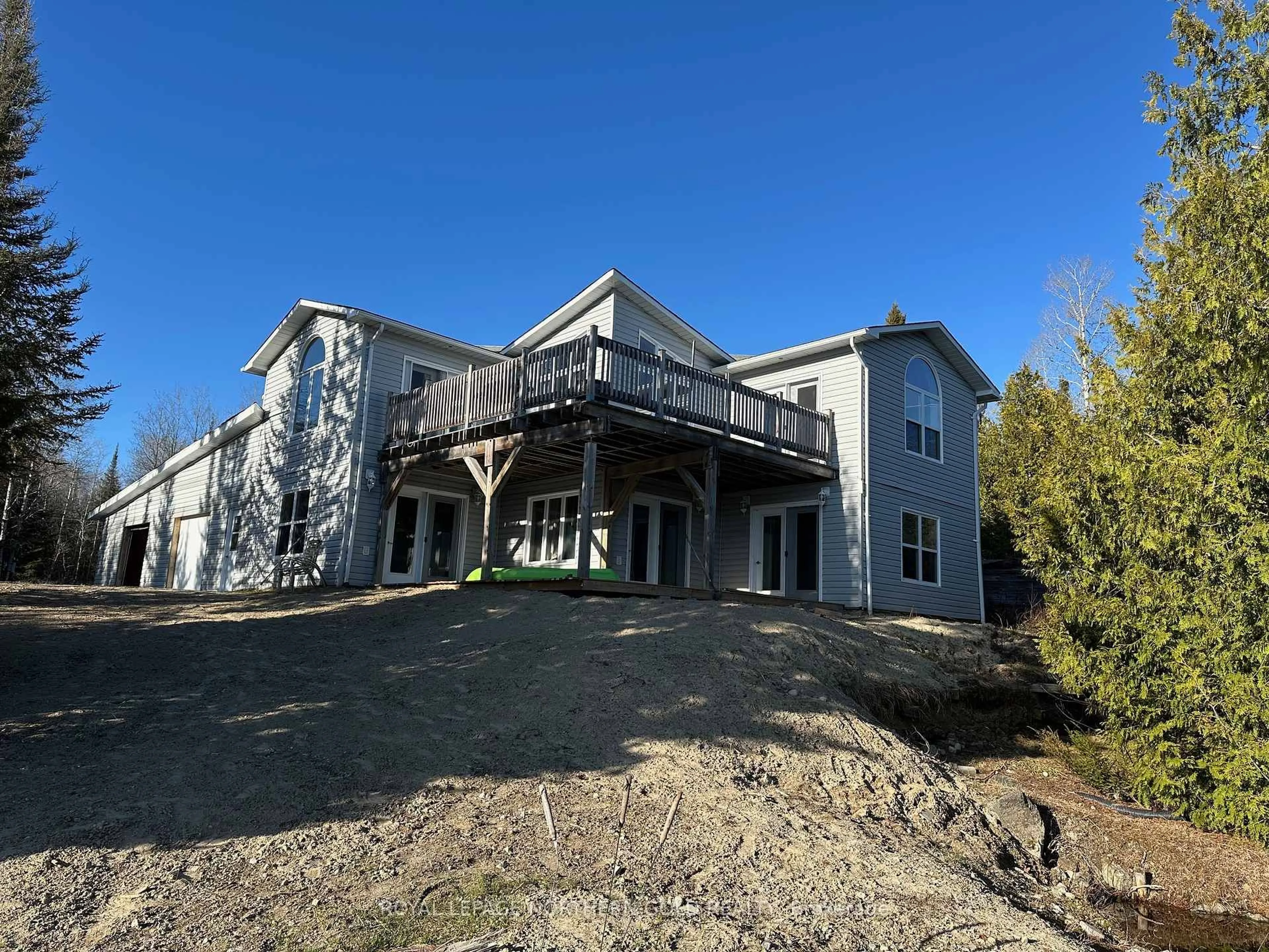 A pic from outside/outdoor area/front of a property/back of a property/a pic from drone, unknown for 410 GRENFELL Rd, Kirkland Lake Ontario P0K 1T0
