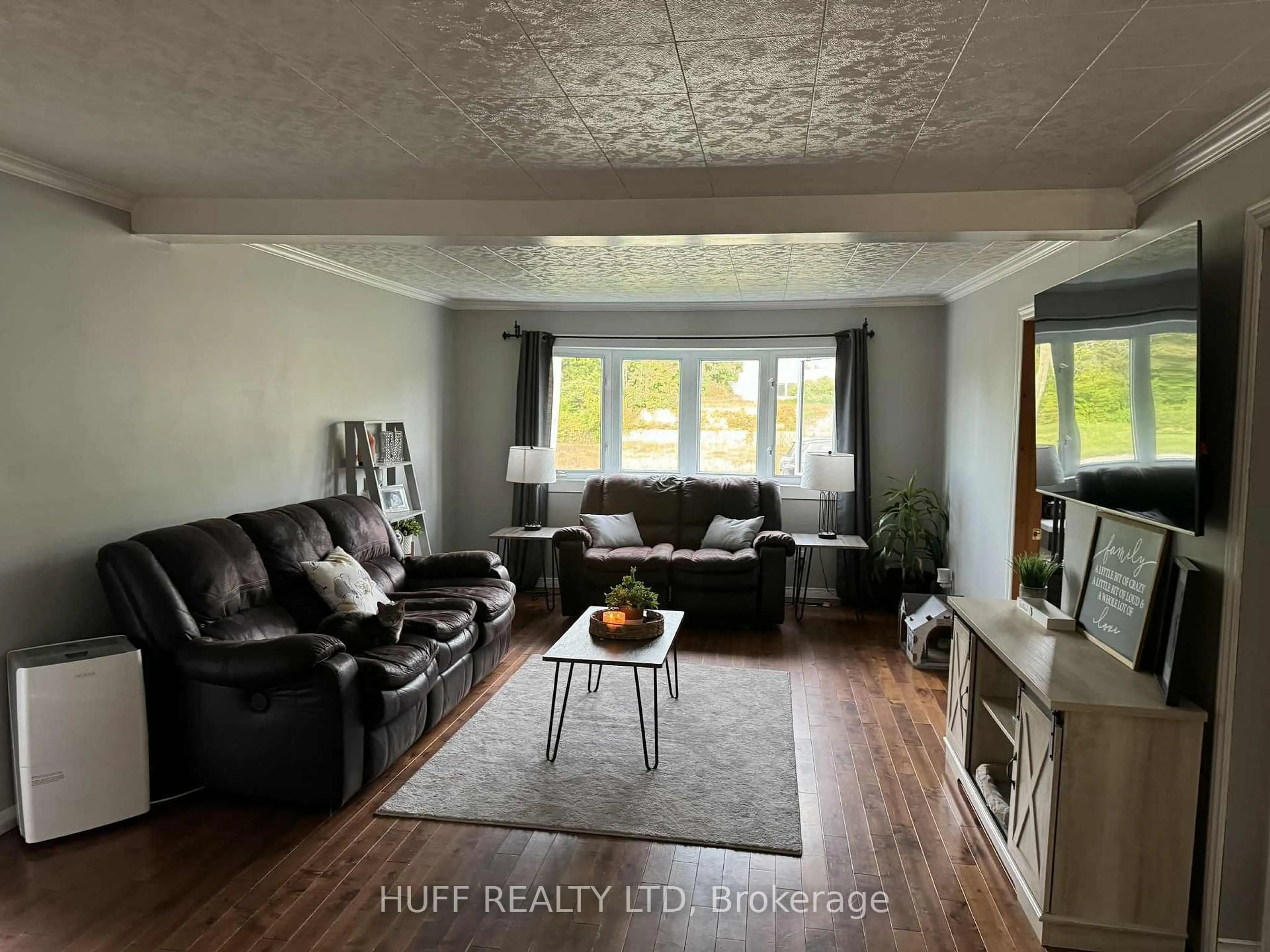 Living room with furniture, wood/laminate floor for 280 Hayes St, Kirkland Lake Ontario P0K 1T0
