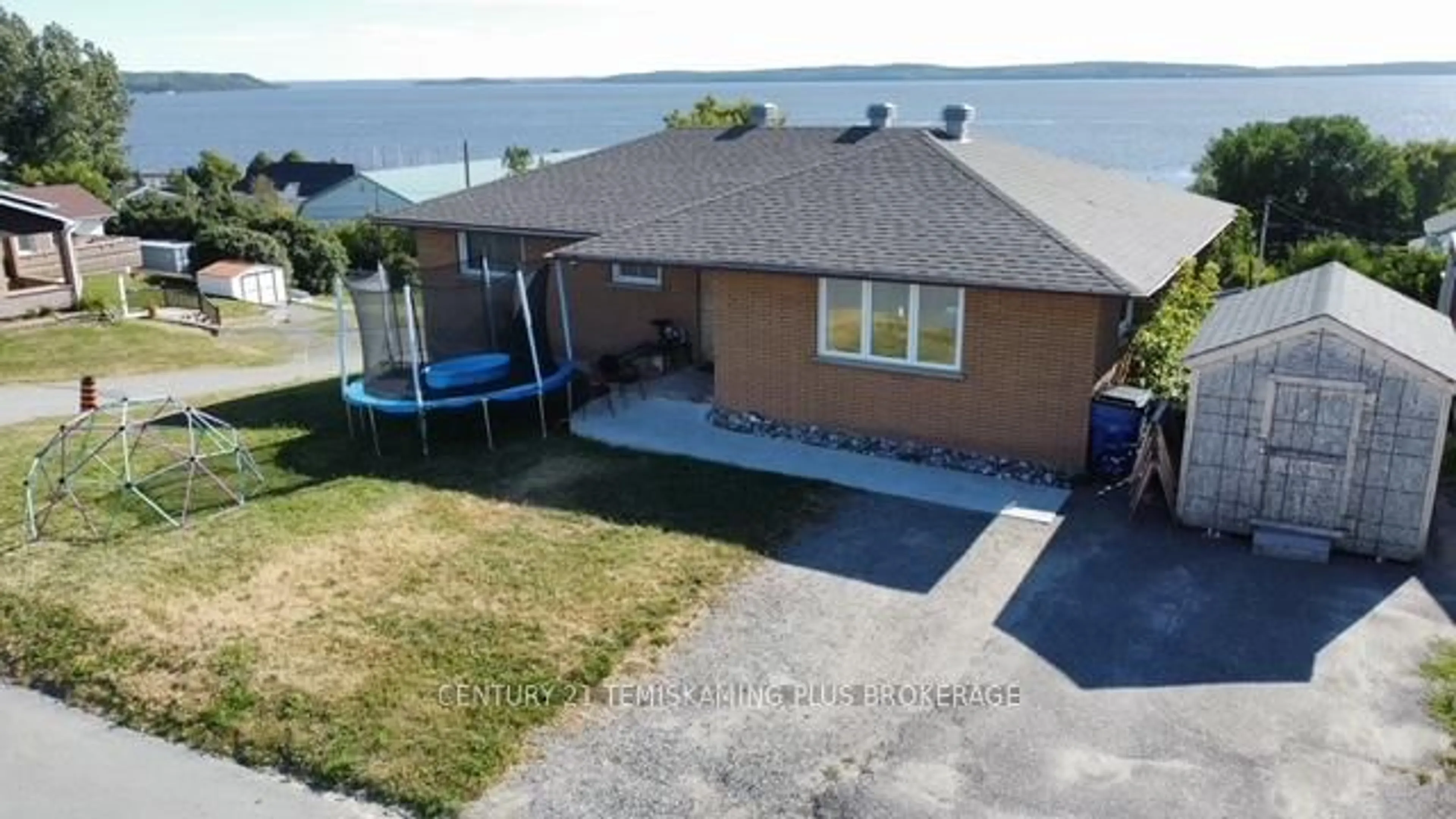 A pic from outside/outdoor area/front of a property/back of a property/a pic from drone, water/lake/river/ocean view for 411 Ferguson Ave, Temiskaming Shores Ontario P0J 1K0