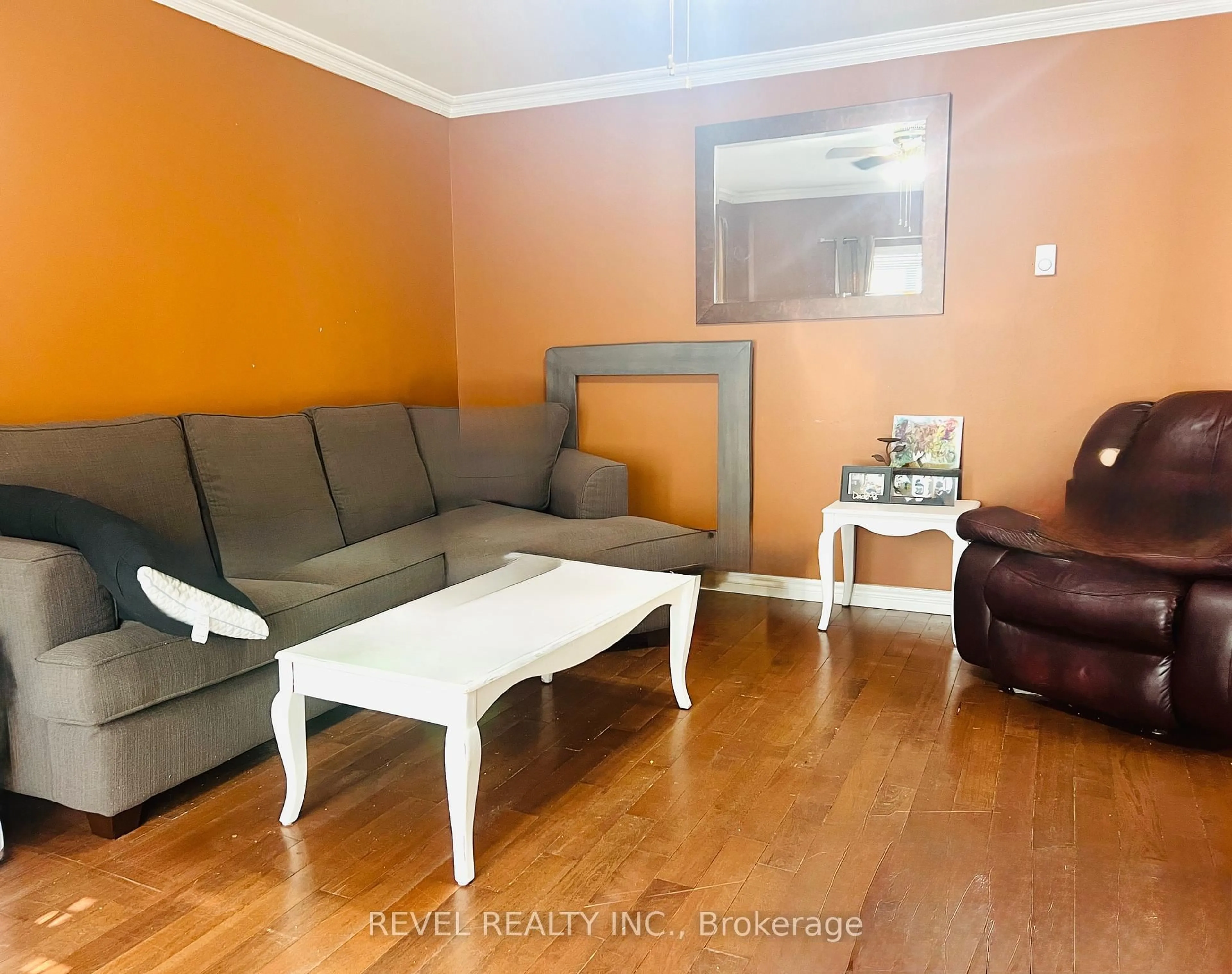 Living room with furniture, wood/laminate floor for 380 Norman St, Timmins Ontario P4N 4B7