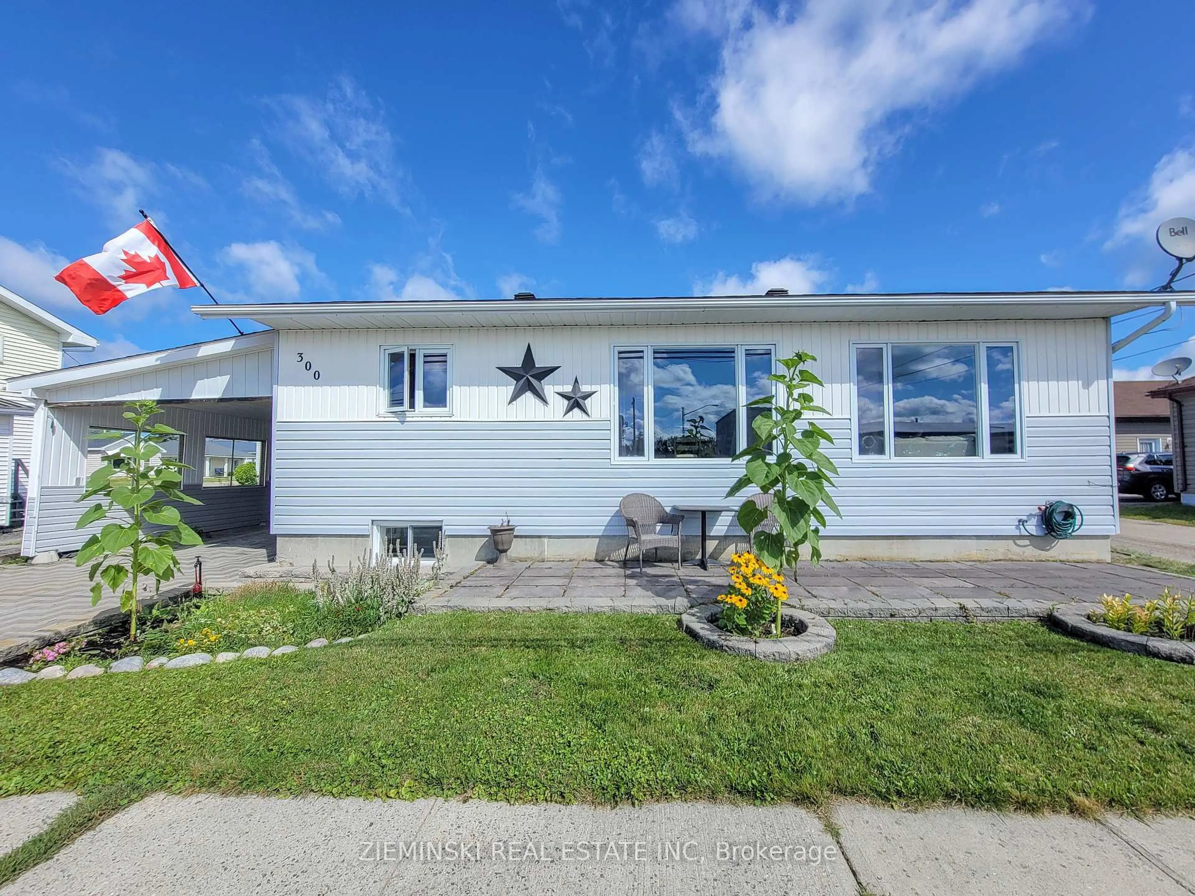 Home with vinyl exterior material, street for 300 Teefy St, Iroquois Falls Ontario P0K 1G0