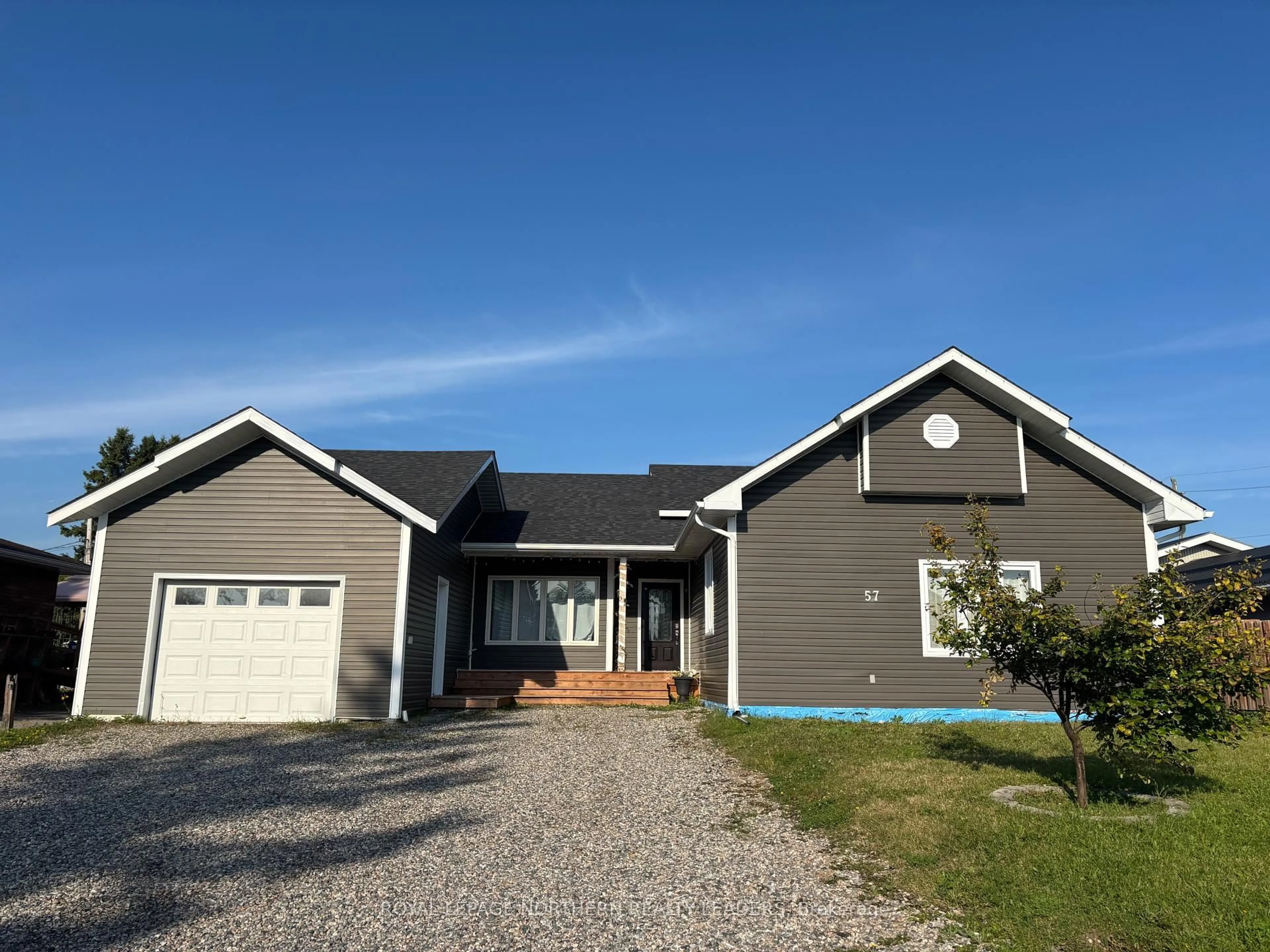 Home with vinyl exterior material, street for 57 Victoria Ave, Cochrane Ontario P0L 1C0