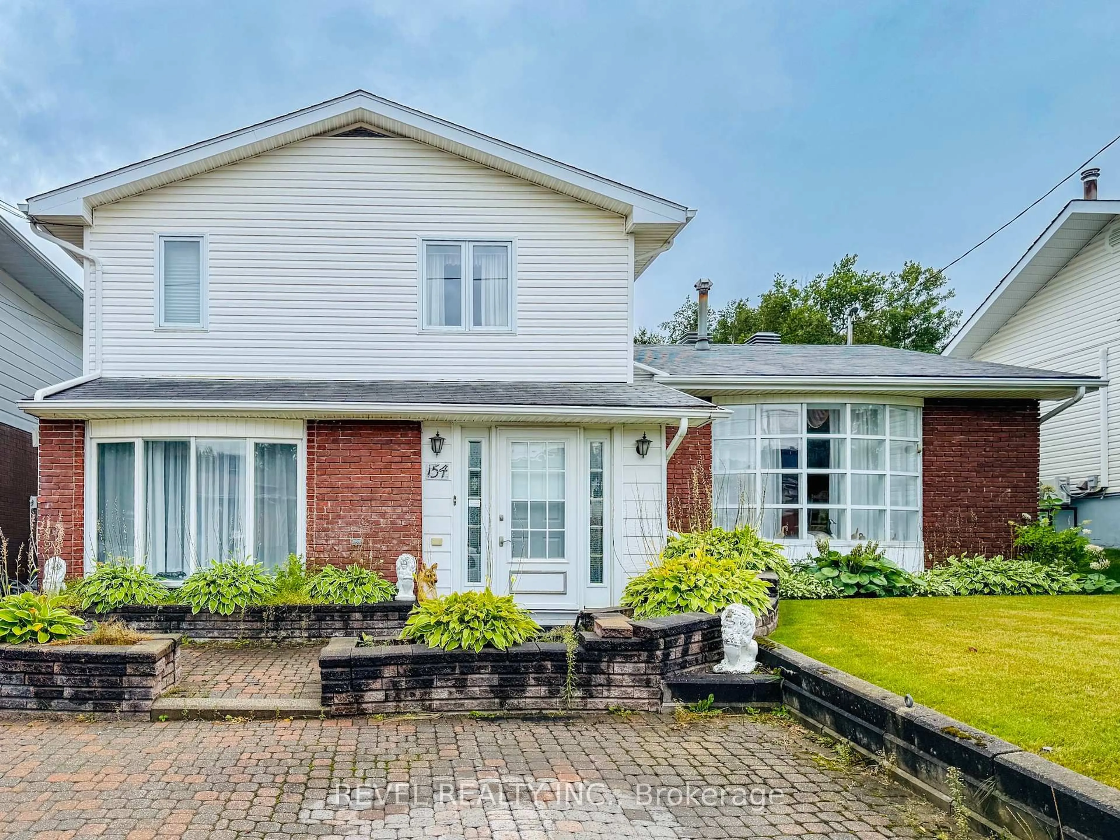 Home with brick exterior material, street for 154 Fourth Ave, Timmins Ontario P0N 1G0