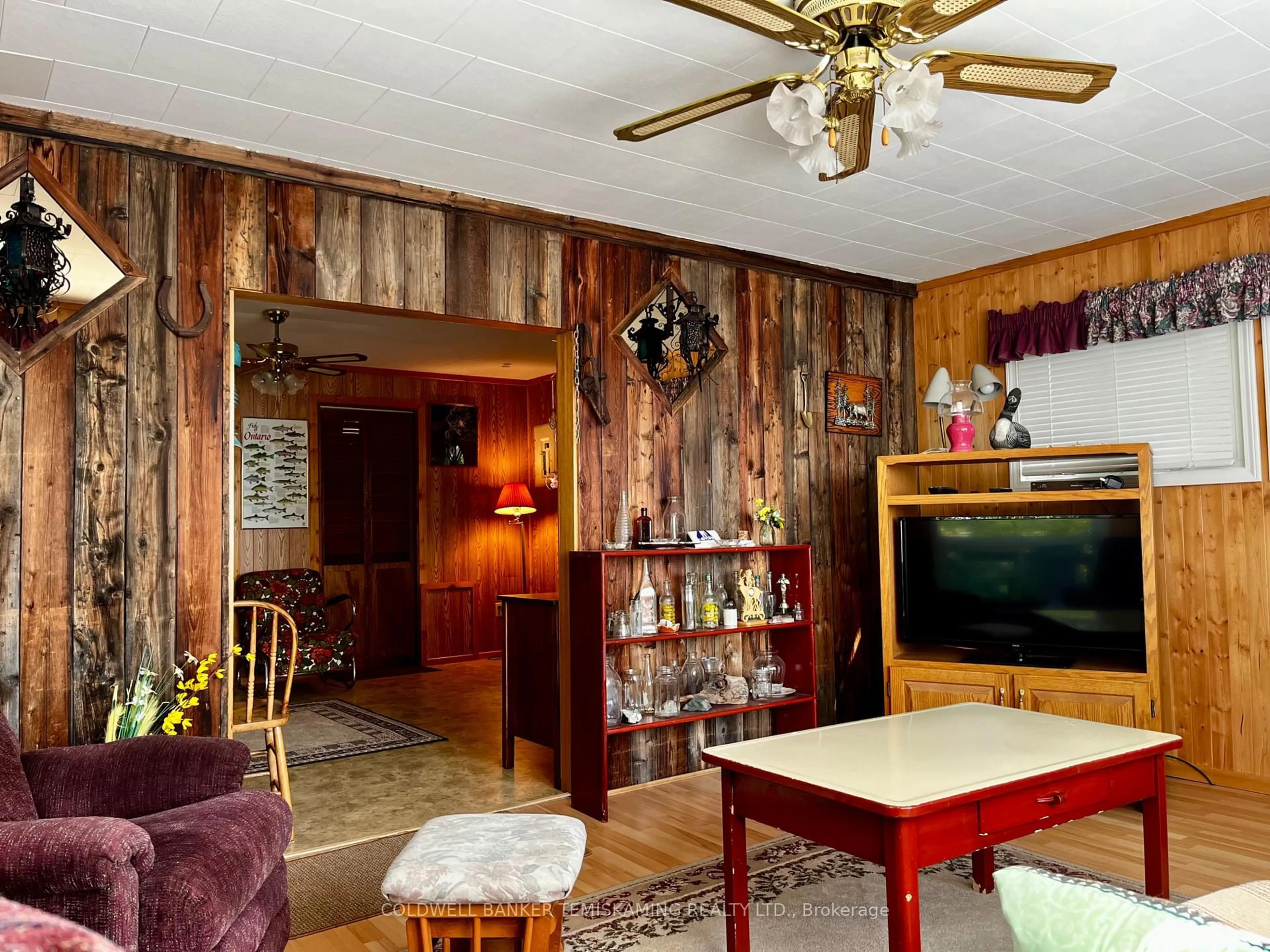 Living room with furniture, wood/laminate floor for 0 Seventh St, Timiskaming Ontario P0J 1J0