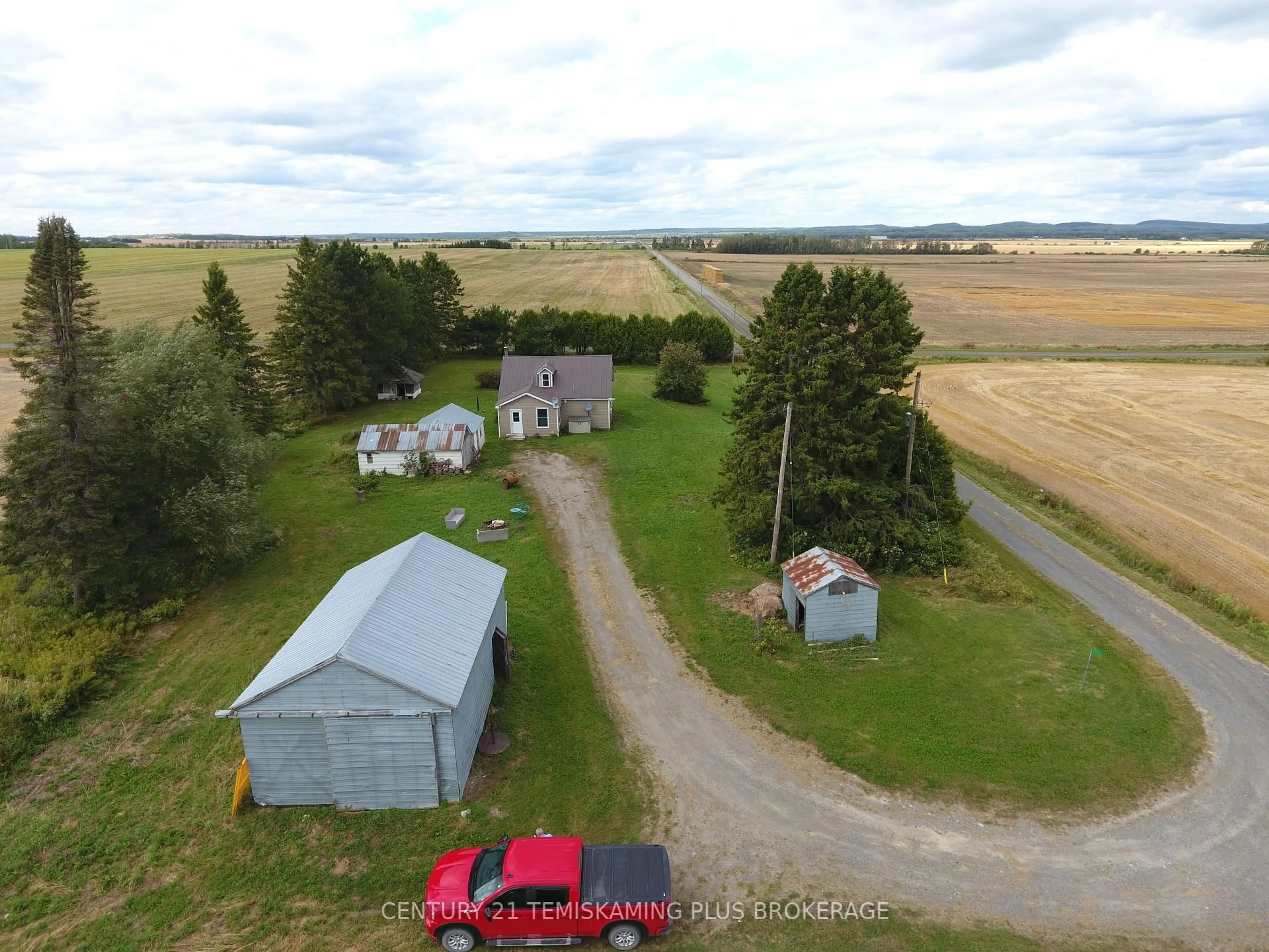 A pic from outside/outdoor area/front of a property/back of a property/a pic from drone, street for 253156 Roger's Rd, Englehart Ontario P0J 1H0