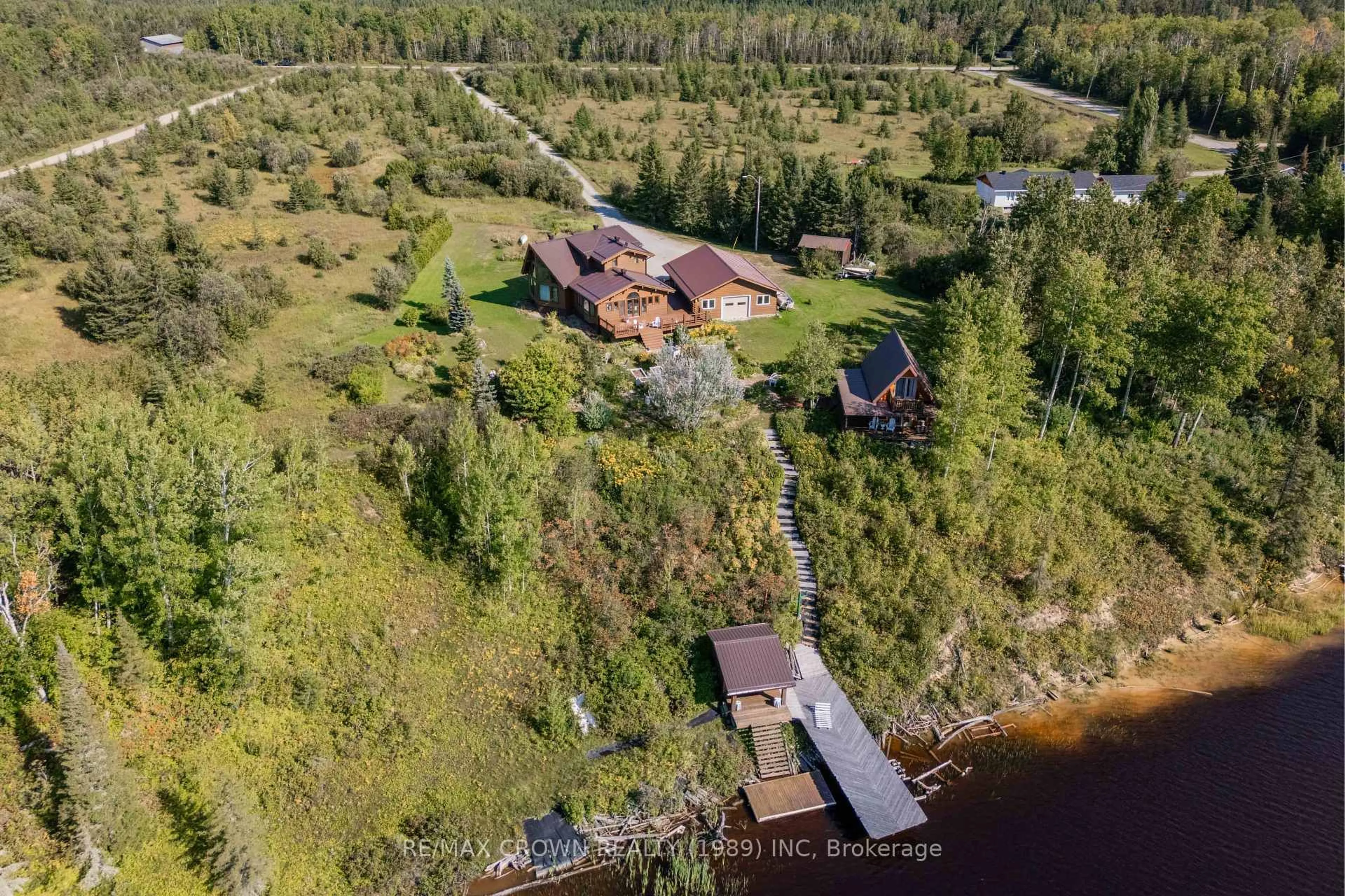 A pic from outside/outdoor area/front of a property/back of a property/a pic from drone, water/lake/river/ocean view for 136 Mitchell Rd, Kapuskasing Ontario P5N 2X8