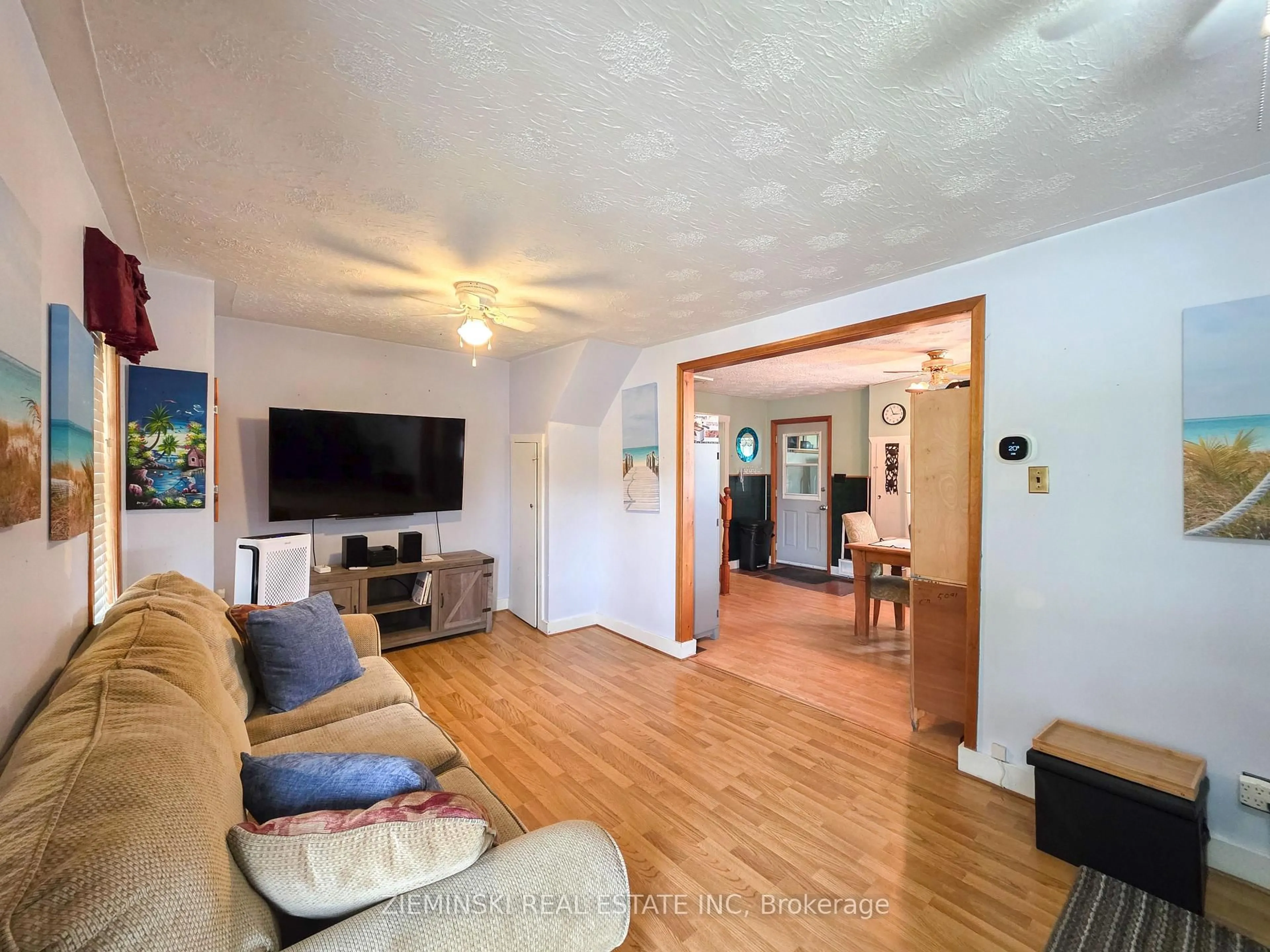 Living room with furniture, wood/laminate floor for 516 Principale St (val Gagne), Black River-Matheson Ontario P0K 1W0