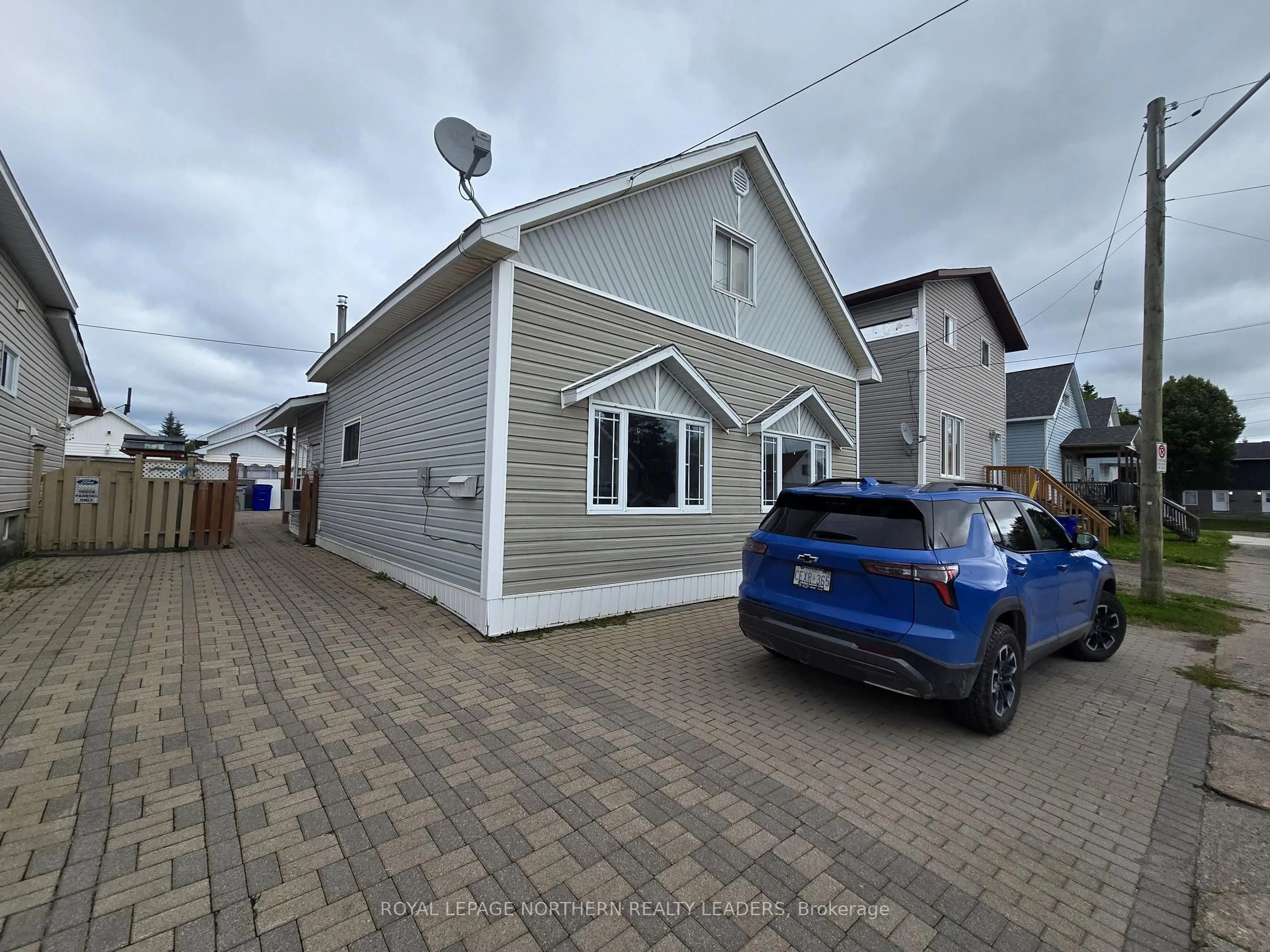 A pic from outside/outdoor area/front of a property/back of a property/a pic from drone, street for 8 Borden Ave, Timmins Ontario P4N 4E7