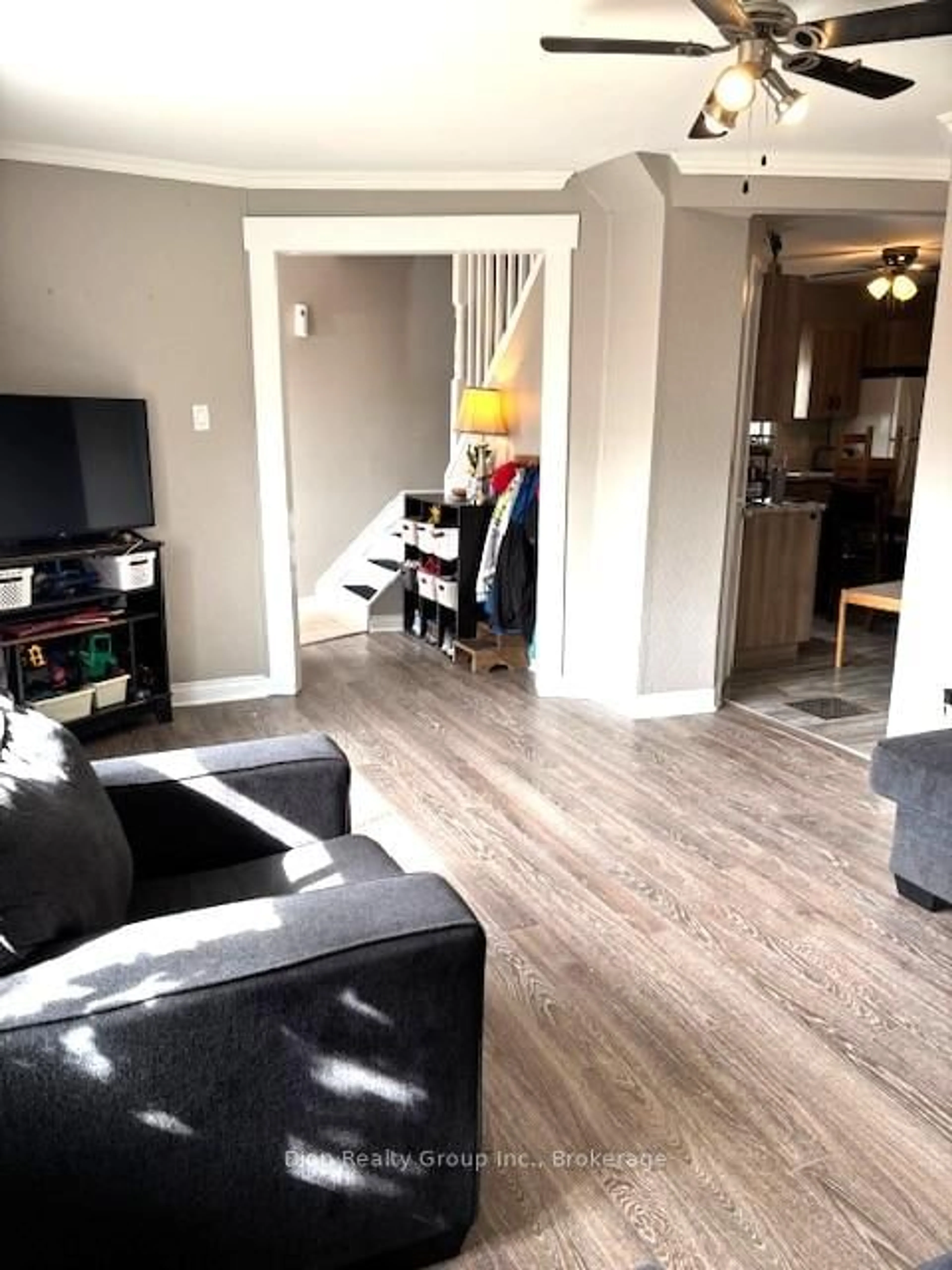 Living room with furniture, wood/laminate floor for 42 Kirkpatrick St, Kirkland Lake Ontario P2N 2G9