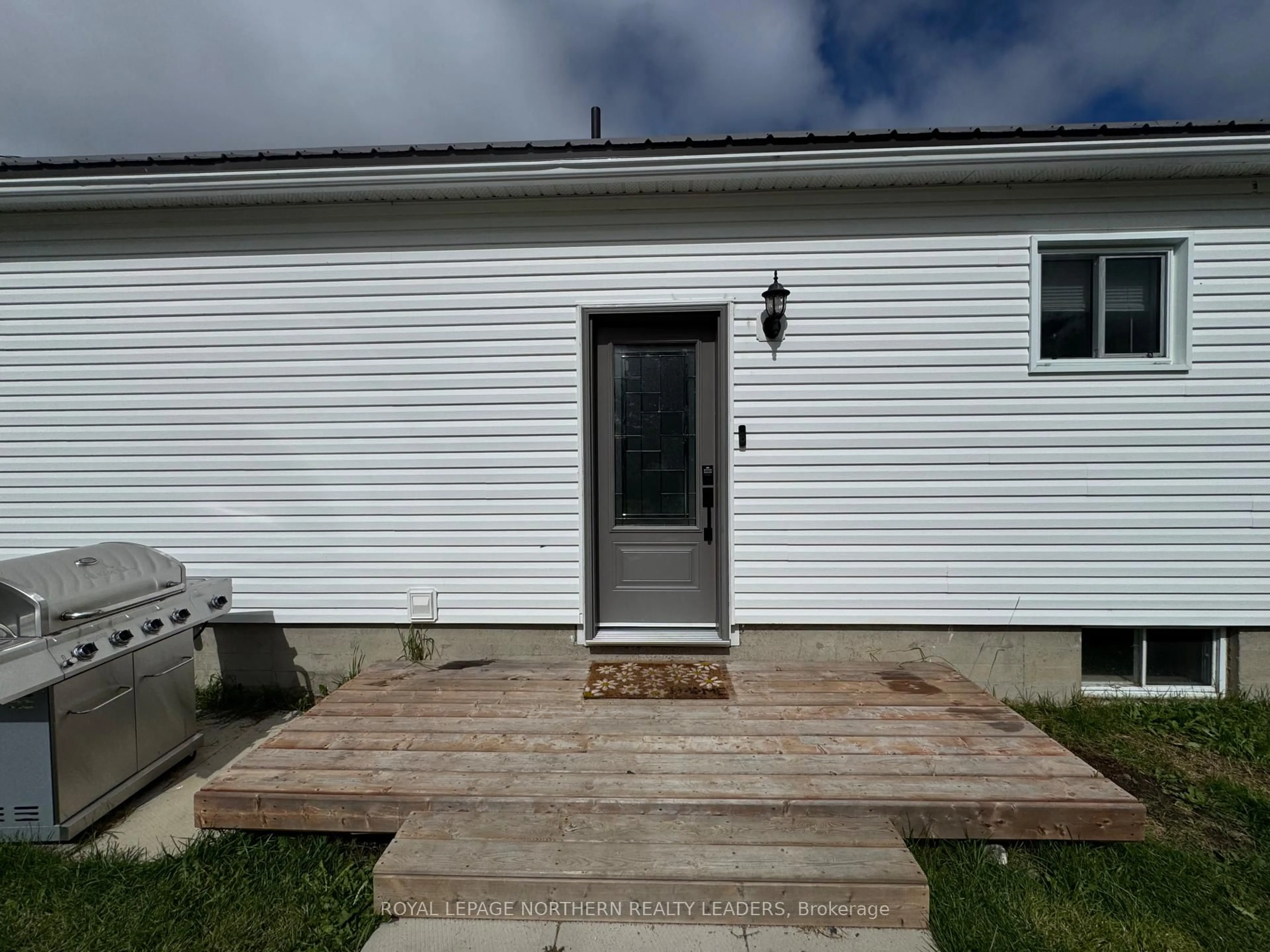 Home with vinyl exterior material, street for 7&9 Quinn Cres, Black River-Matheson Ontario P0K 1N0