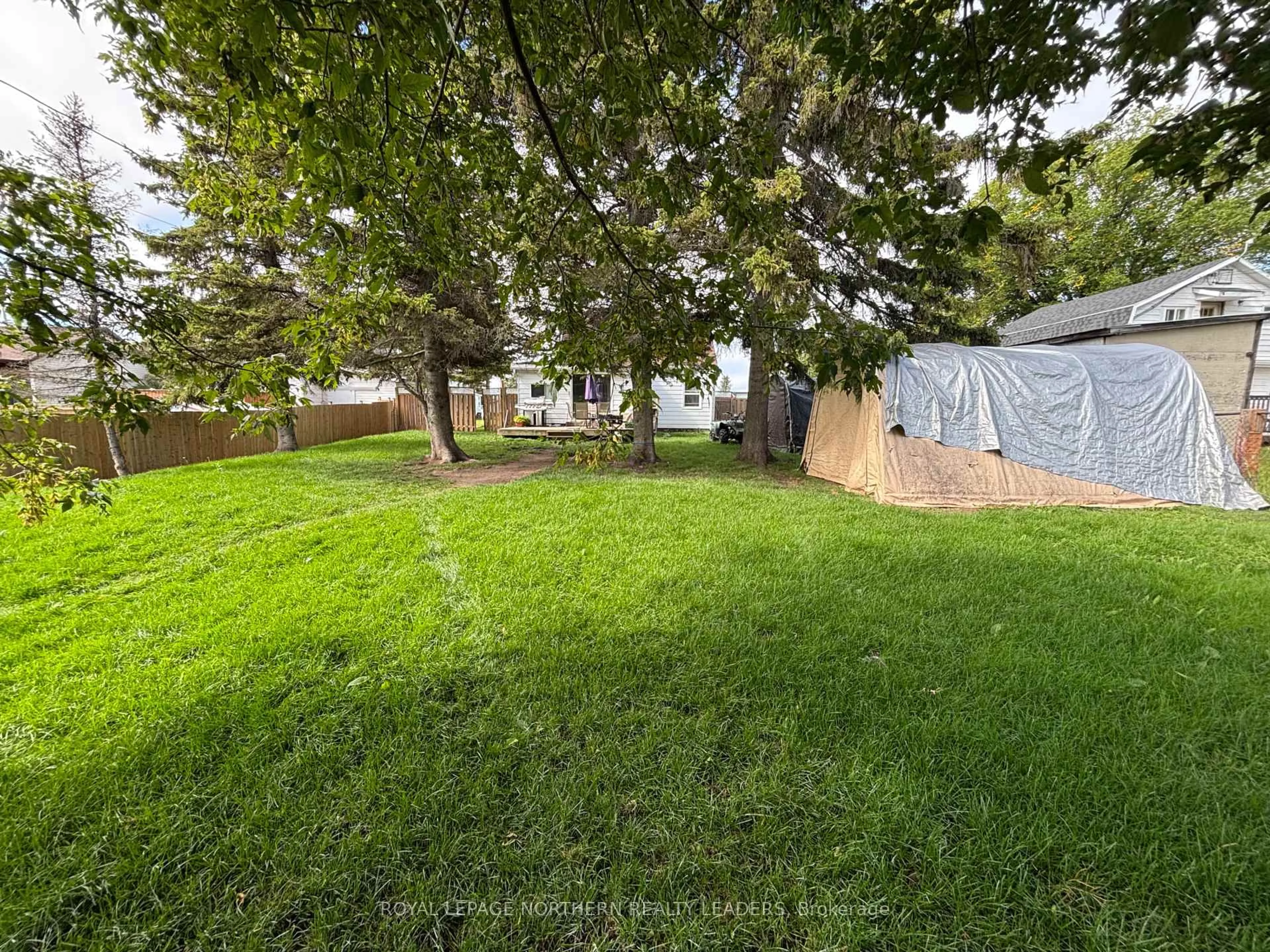 A pic from outside/outdoor area/front of a property/back of a property/a pic from drone, forest/trees view for 124 Fourteenth Ave, Cochrane Ontario P0L 1C0