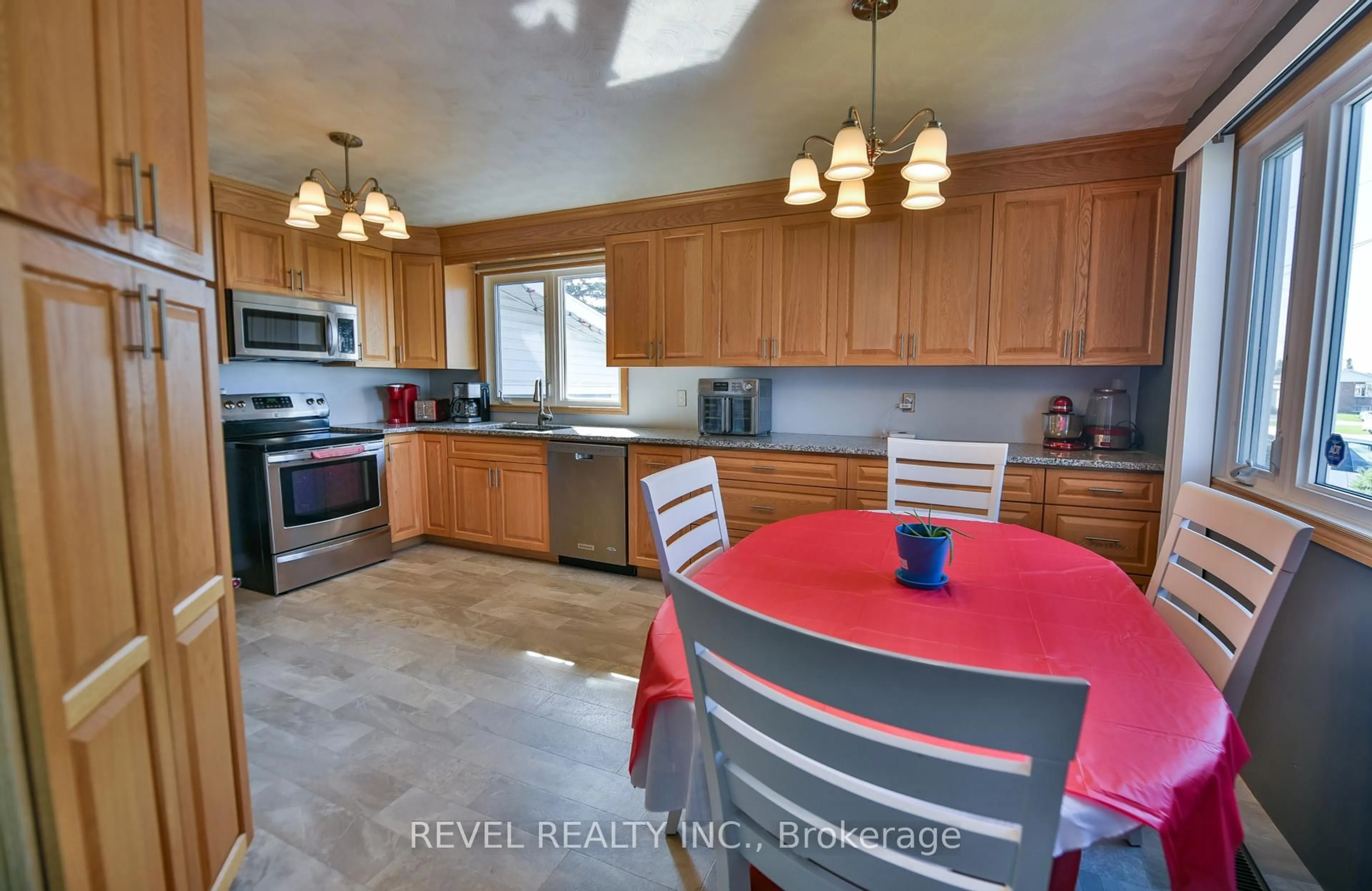 Open concept kitchen, ceramic/tile floor for 209 Ottolen St, Timmins Ontario P0N 1C0