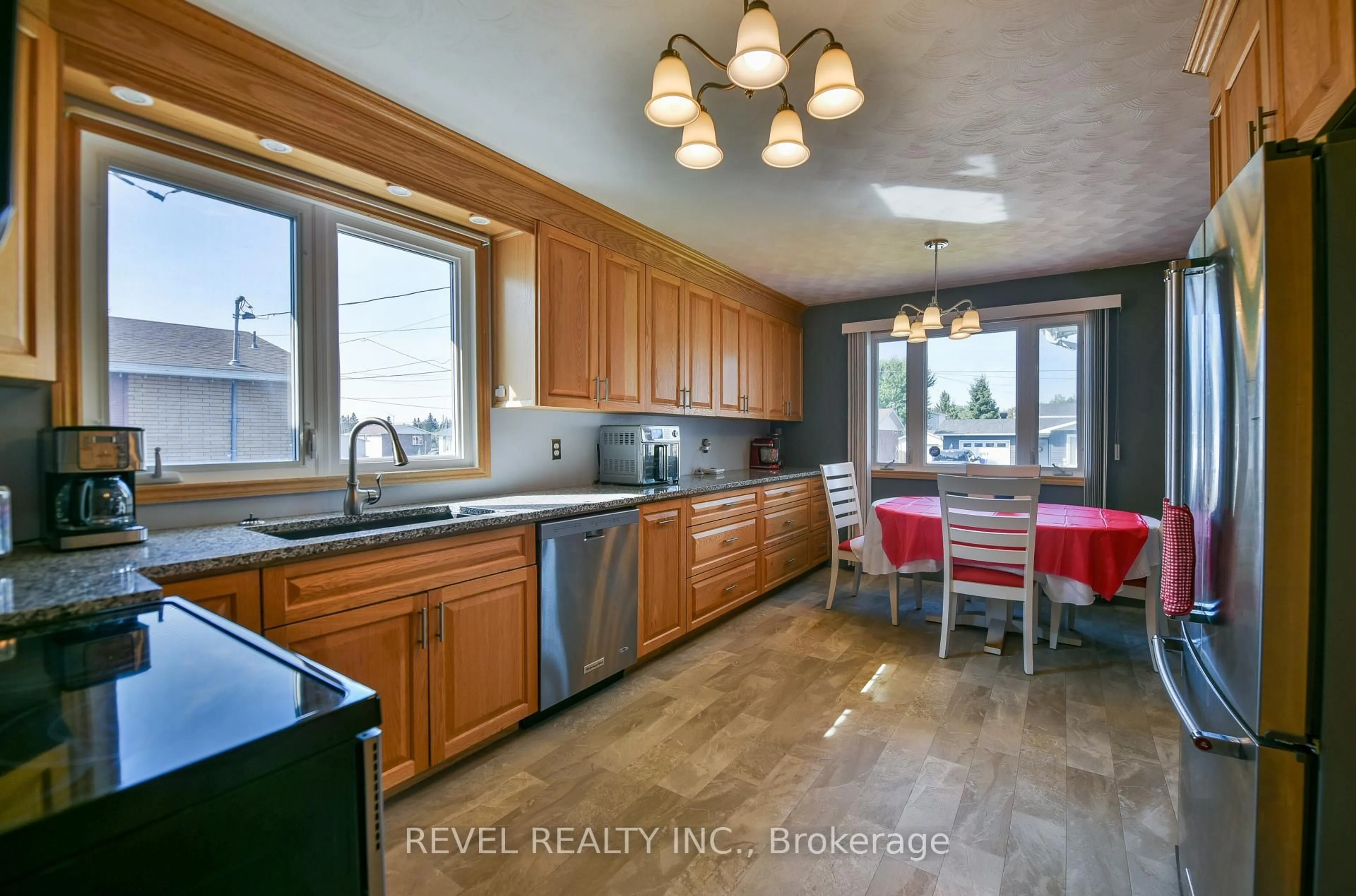 Open concept kitchen, ceramic/tile floor for 209 Ottolen St, Timmins Ontario P0N 1C0