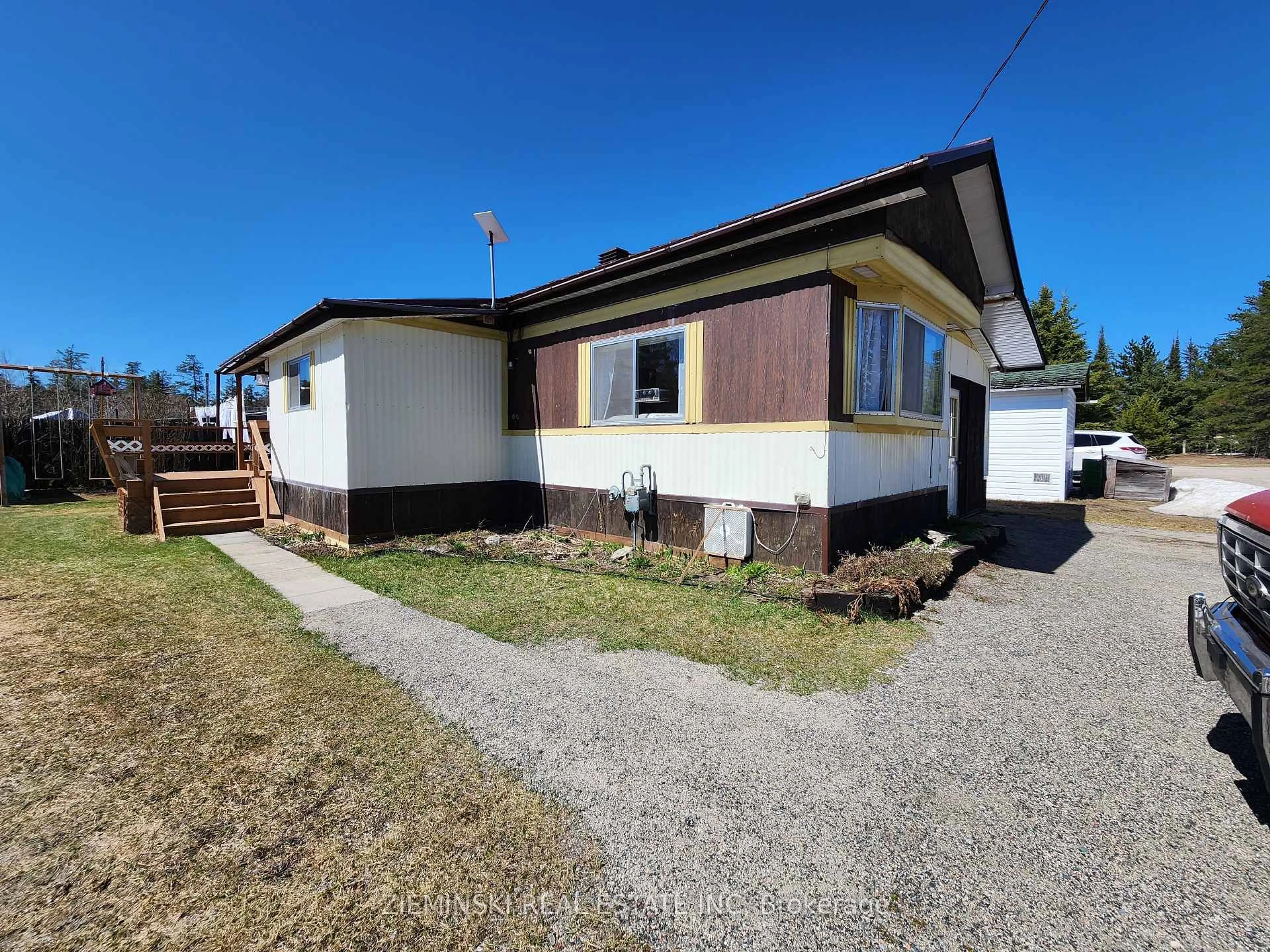 Home with vinyl exterior material, street for 9-8885 11 Highway, Iroquois Falls Ontario P0K 1G0
