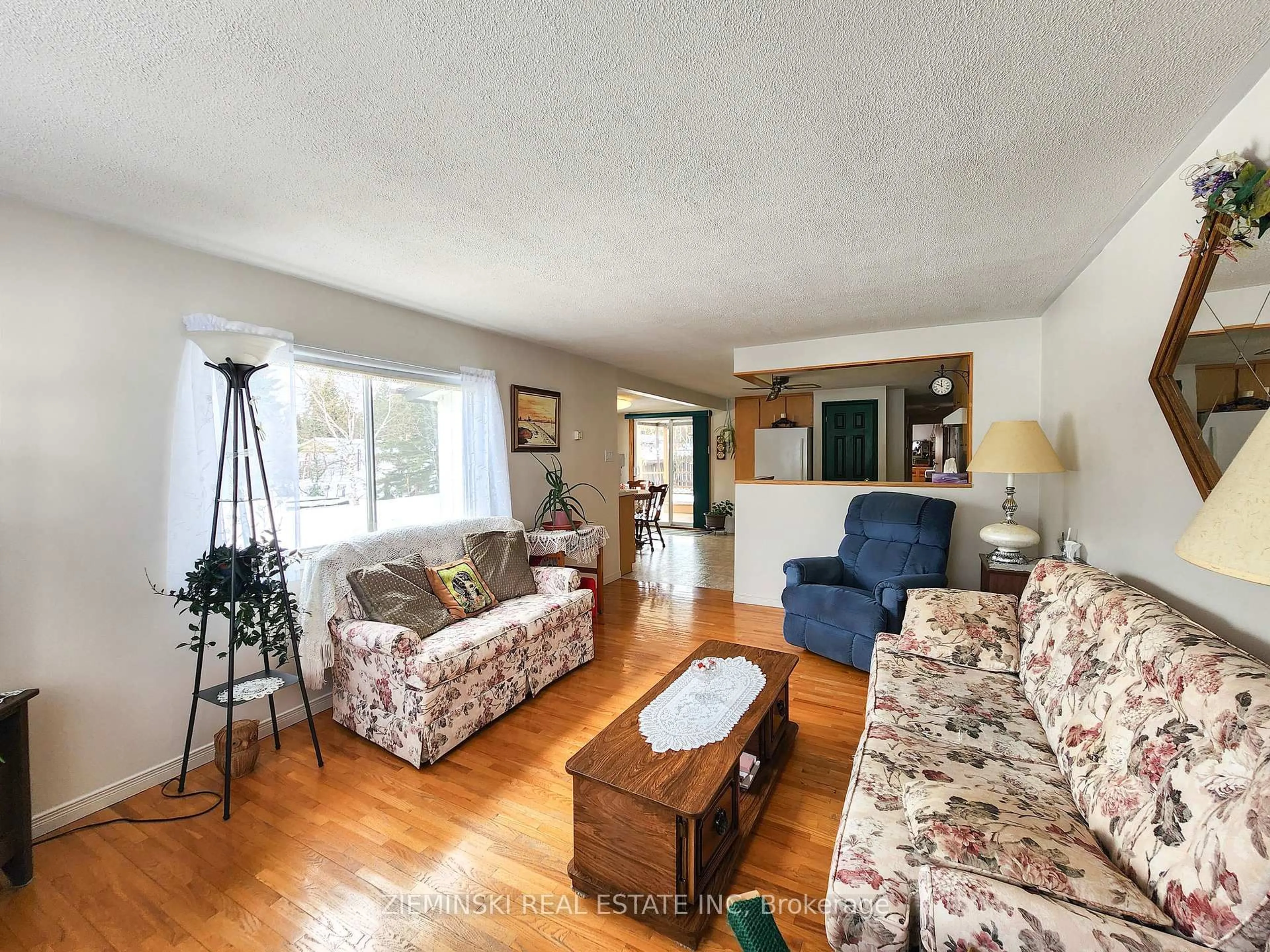 Living room with furniture, wood/laminate floor for 9-8885 11 Highway, Iroquois Falls Ontario P0K 1G0