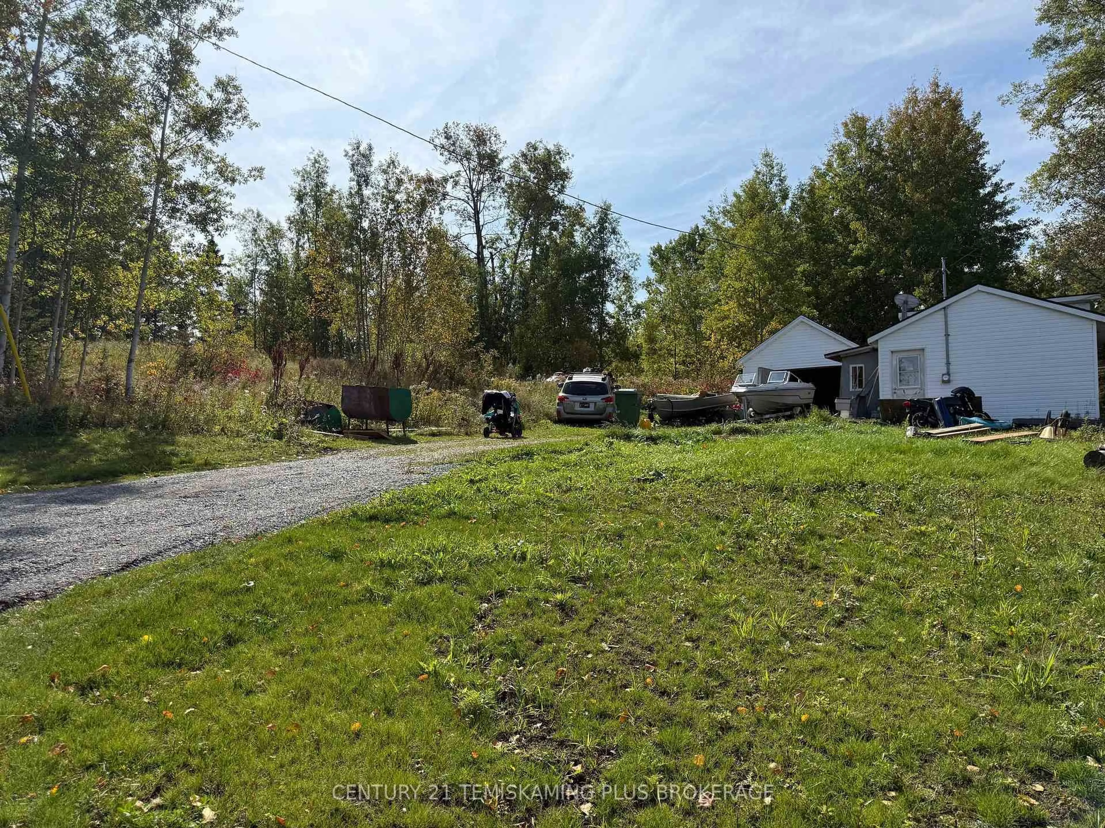 A pic from outside/outdoor area/front of a property/back of a property/a pic from drone, forest/trees view for 1&3 Colville St, Kirkland Lake Ontario P0K 1X0