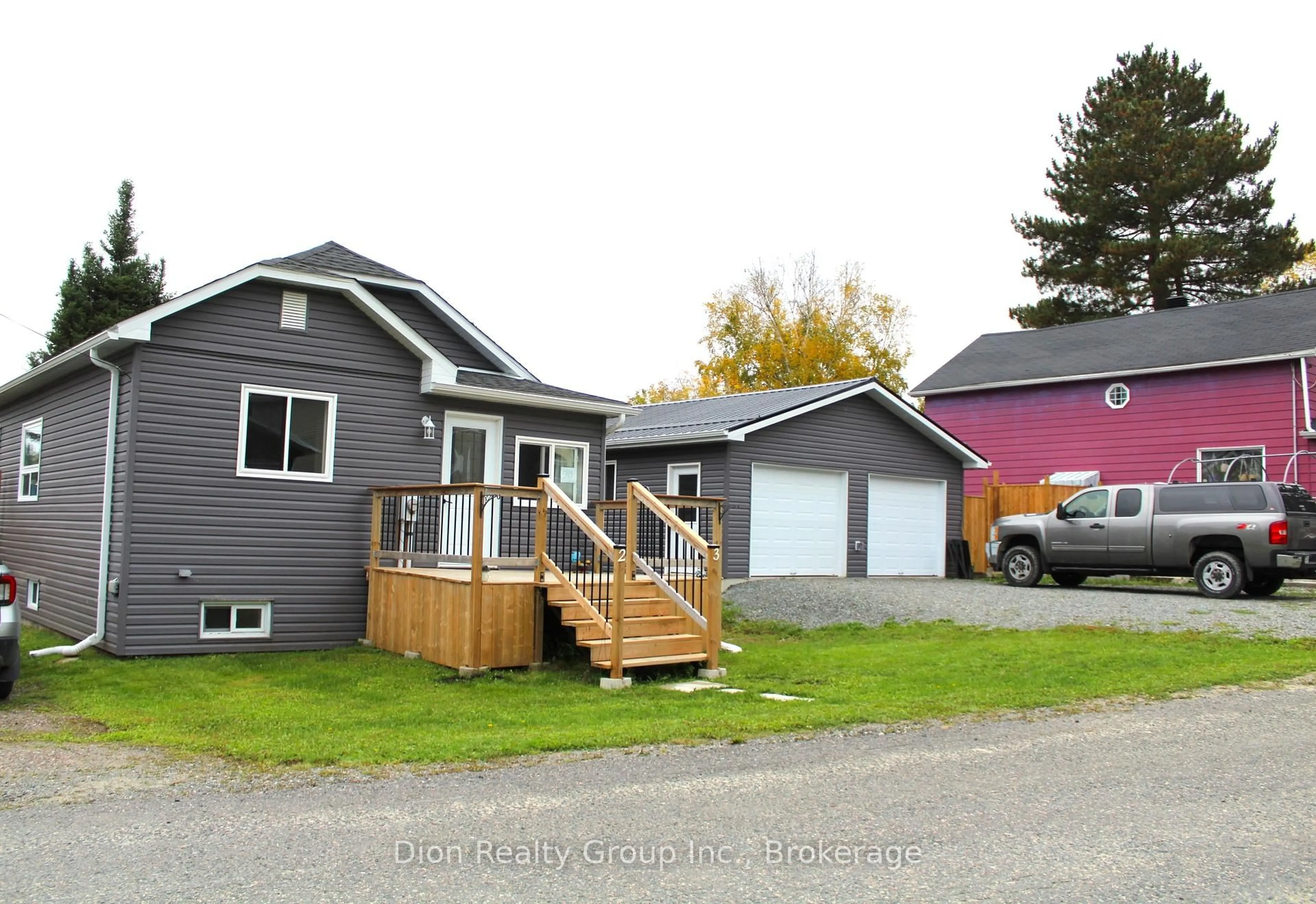 Home with vinyl exterior material, street for 19-23 Connaught Ave, Kirkland Lake Ontario P0K 1T0