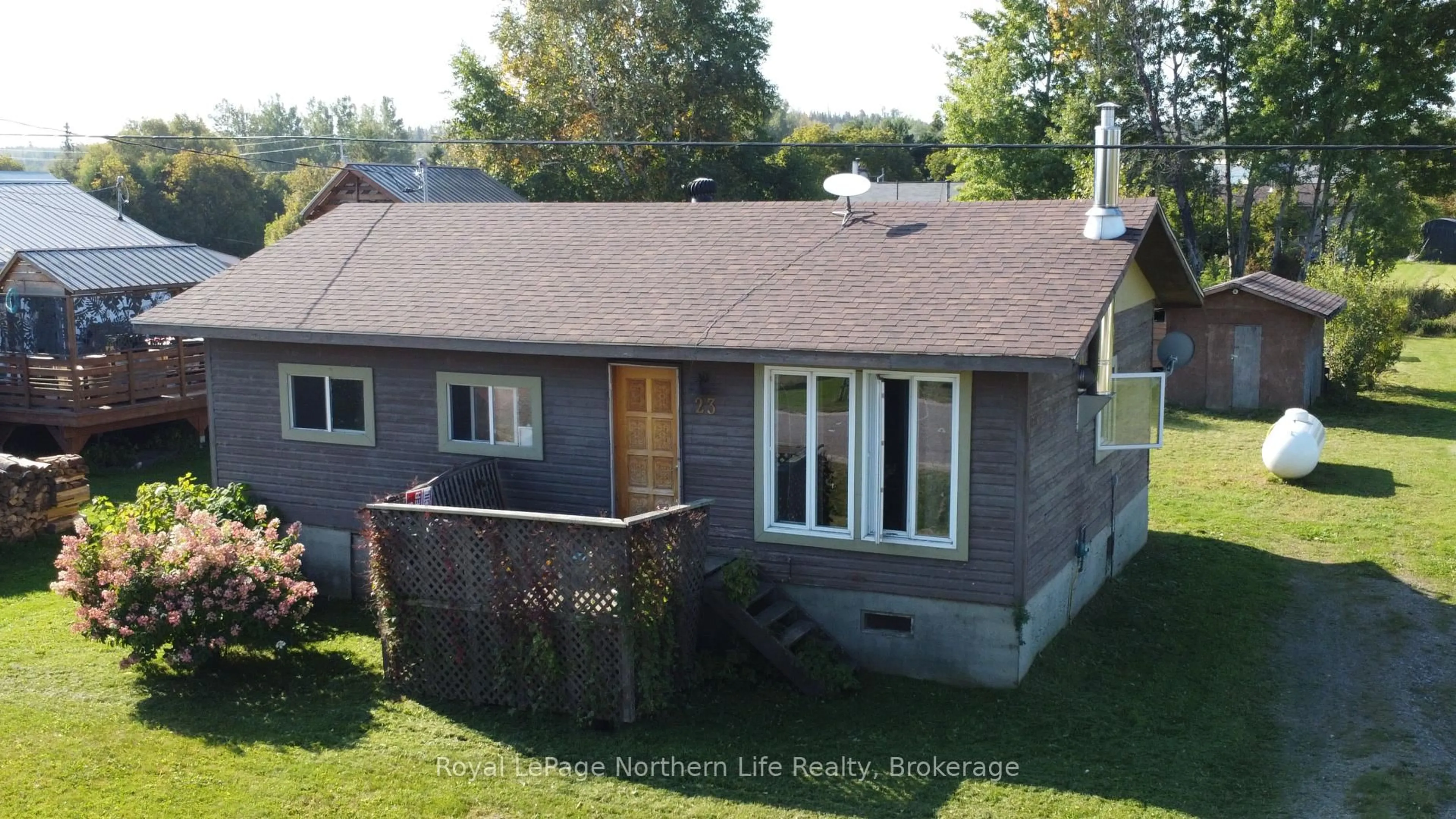 A pic from outside/outdoor area/front of a property/back of a property/a pic from drone, street for 23 4TH St, Timiskaming Ontario P0M 1H0