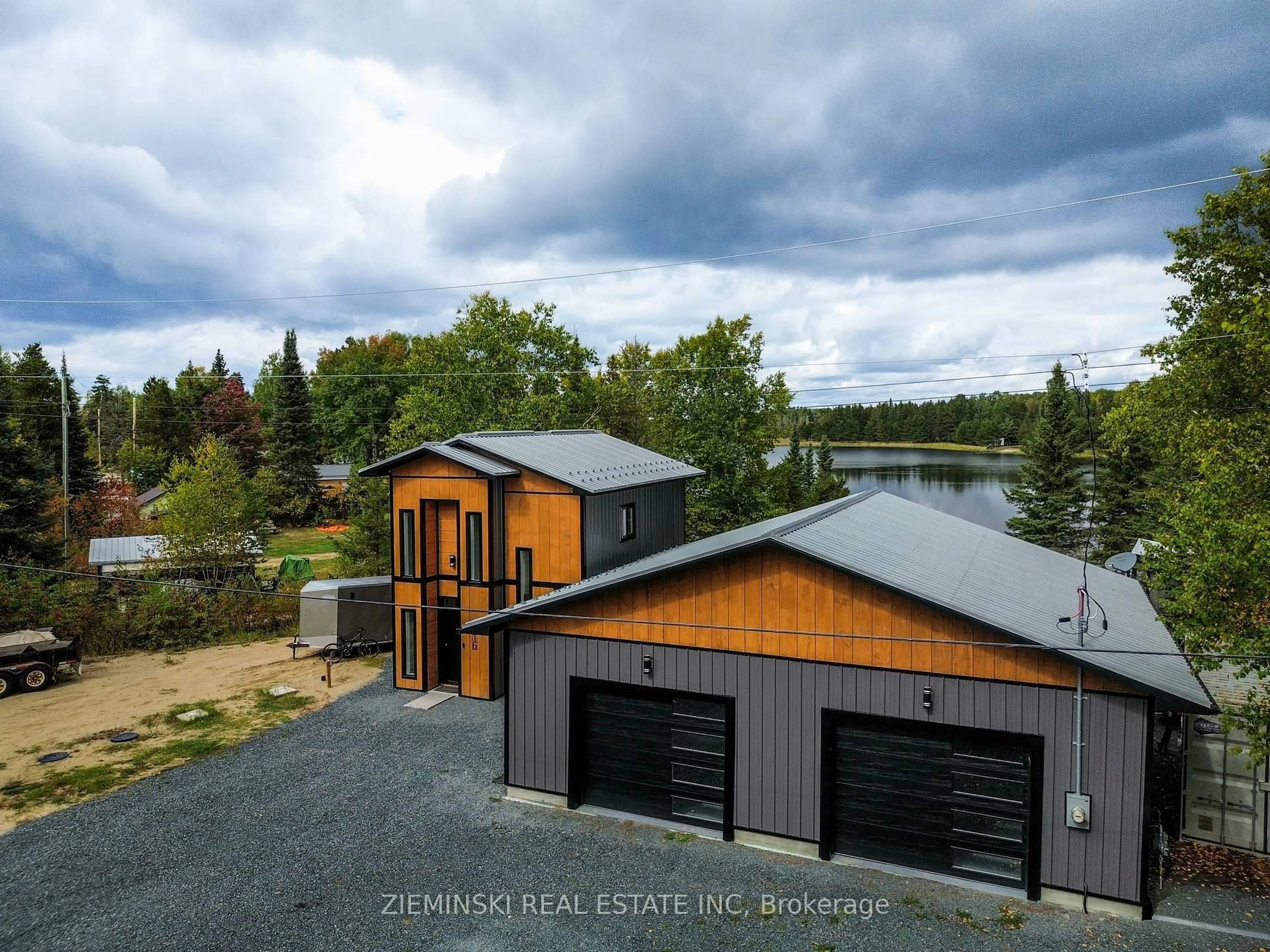 A pic from outside/outdoor area/front of a property/back of a property/a pic from drone, water/lake/river/ocean view for 1016 Highway Beach Rd, Iroquois Falls Ontario P0K 1G0