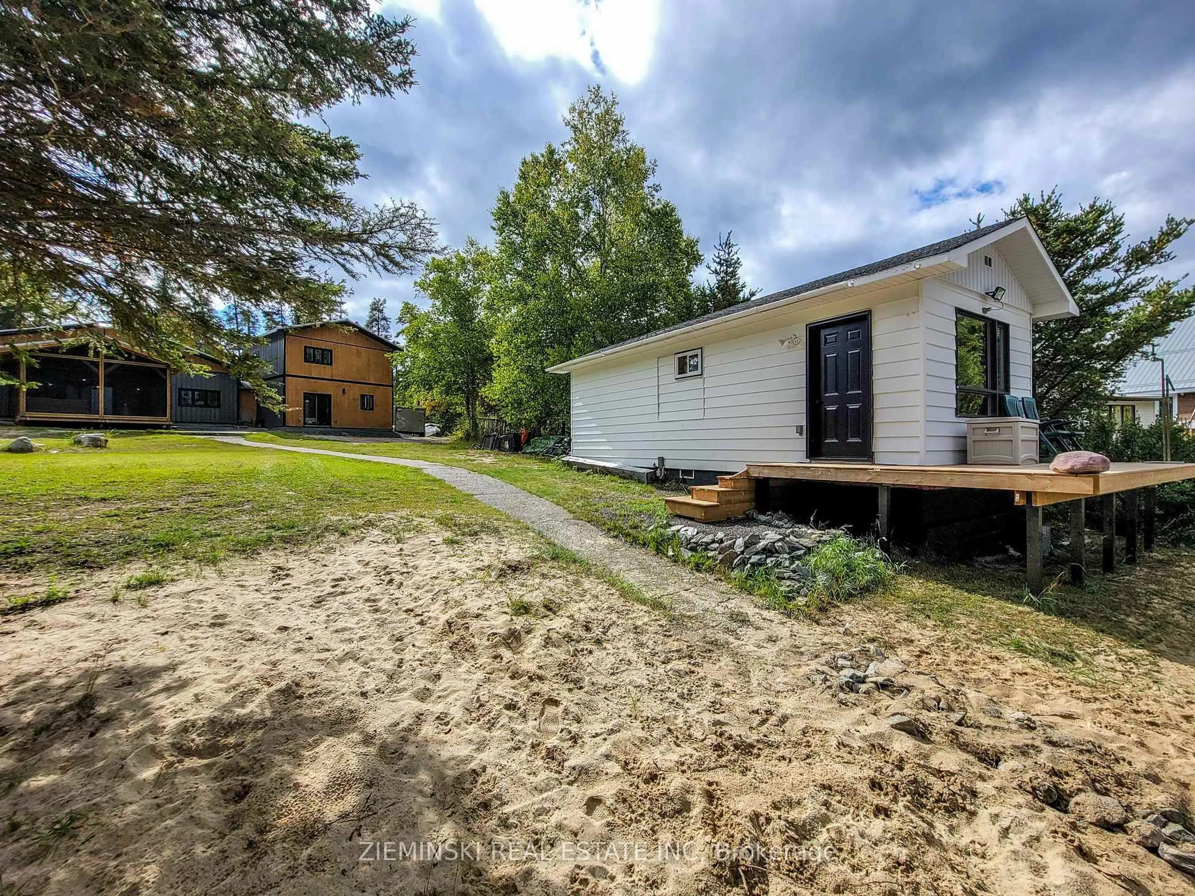 A pic from outside/outdoor area/front of a property/back of a property/a pic from drone, unknown for 1016 Highway Beach Rd, Iroquois Falls Ontario P0K 1G0
