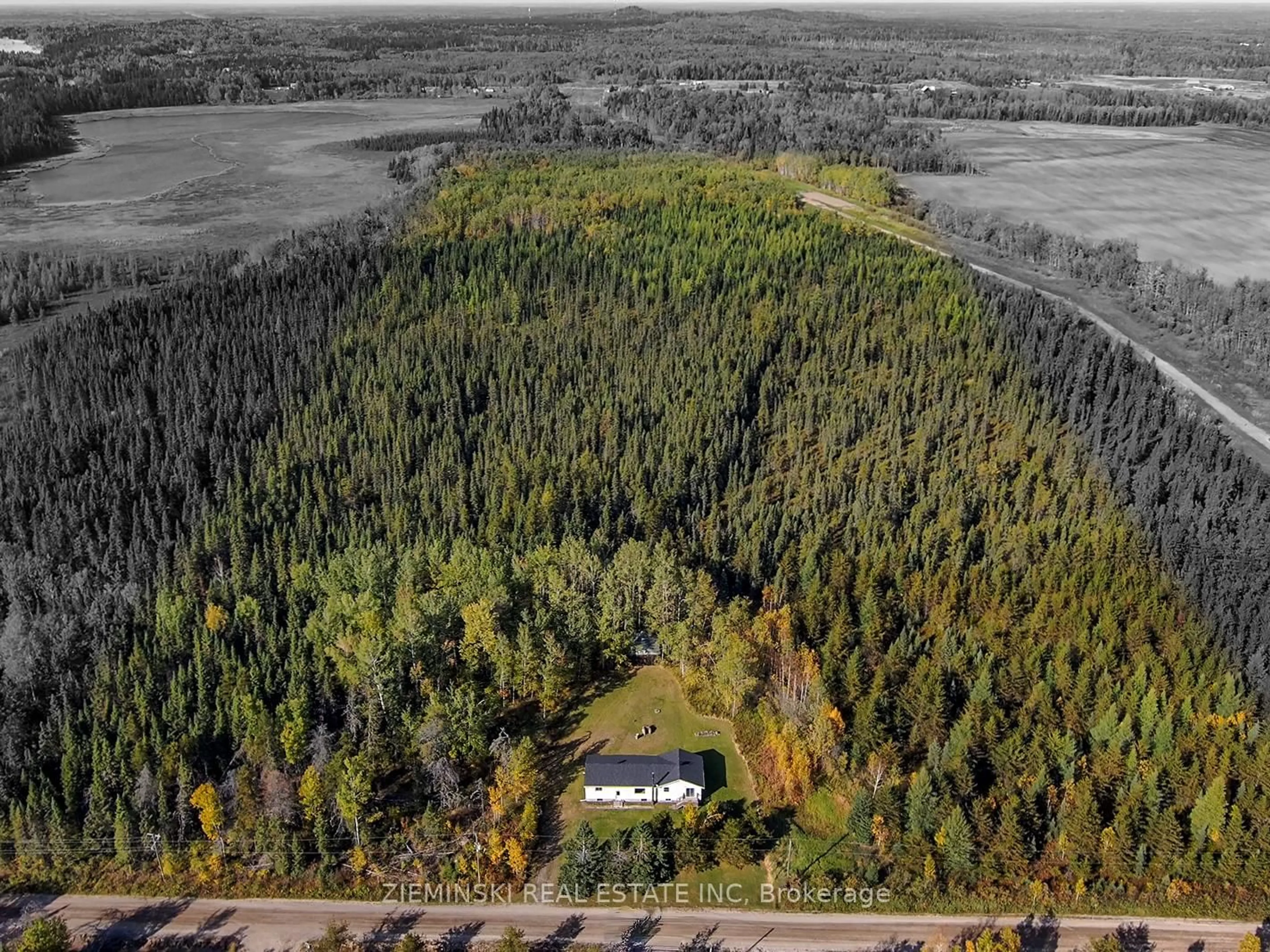 A pic from outside/outdoor area/front of a property/back of a property/a pic from drone, forest/trees view for 1099 Besaw Rd, Iroquois Falls Ontario P0K 1G0