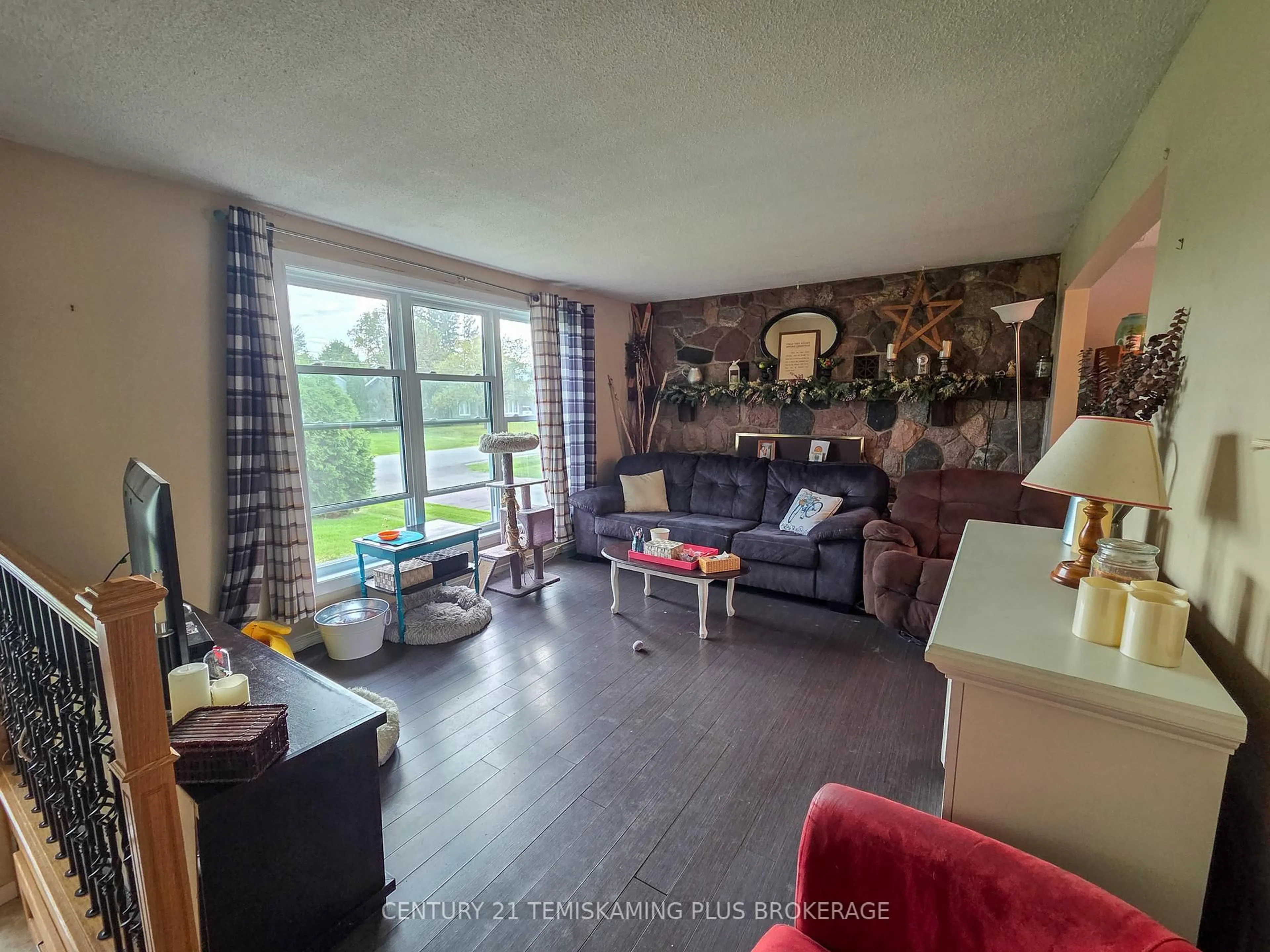 Living room with furniture, wood/laminate floor for 47 Eighth Ave, Englehart Ontario P0J 1H0