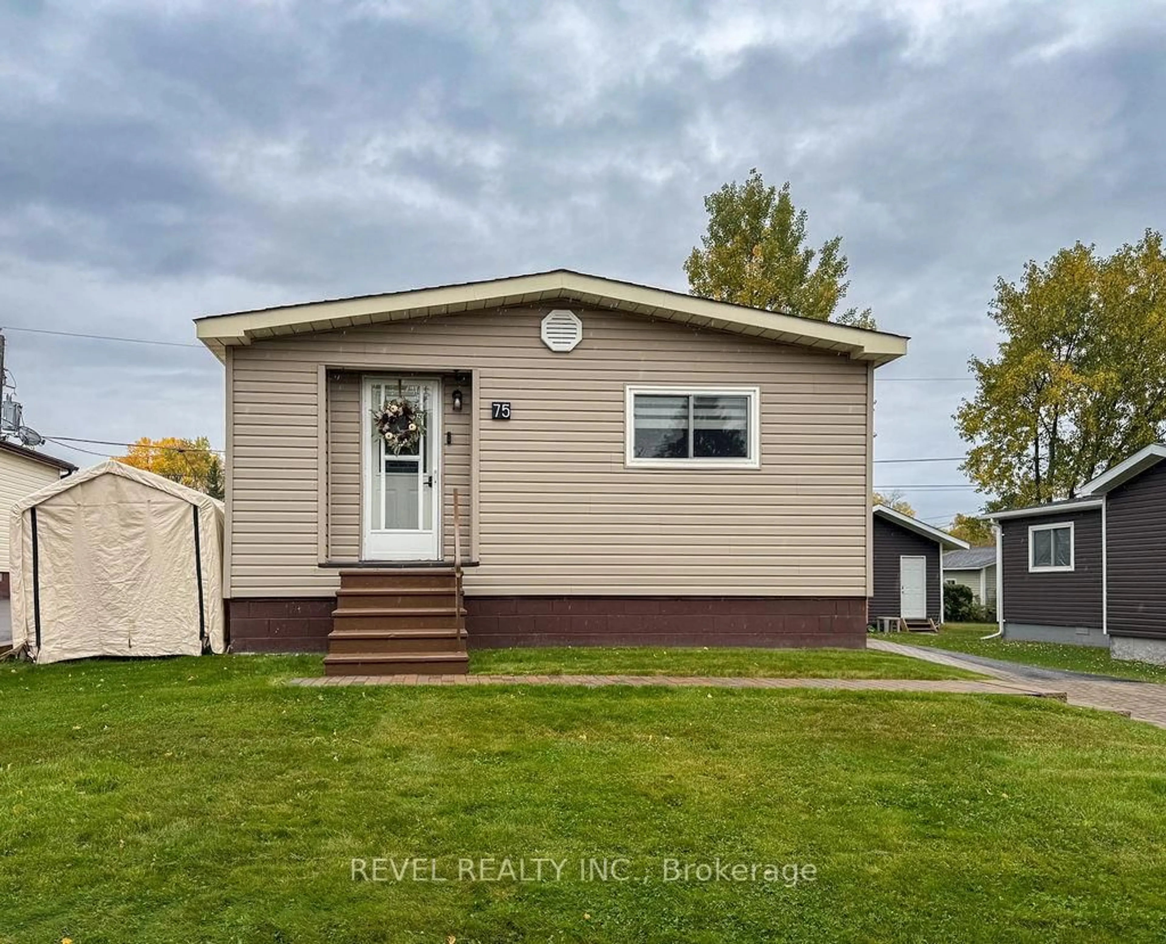 Home with vinyl exterior material, street for 75 Homestead Dr, Timmins Ontario P4N 8R9
