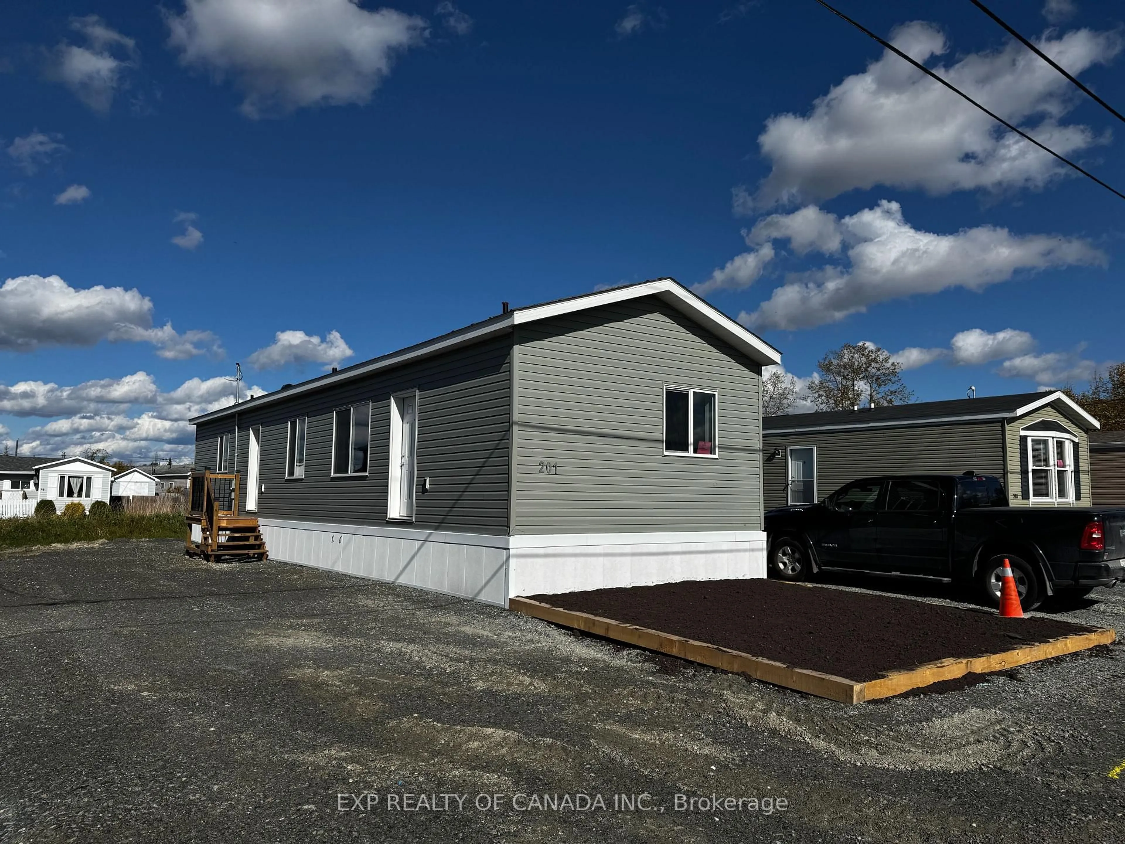 Home with vinyl exterior material, street for 201 Remi Cres, Timmins Ontario P4N 0C5
