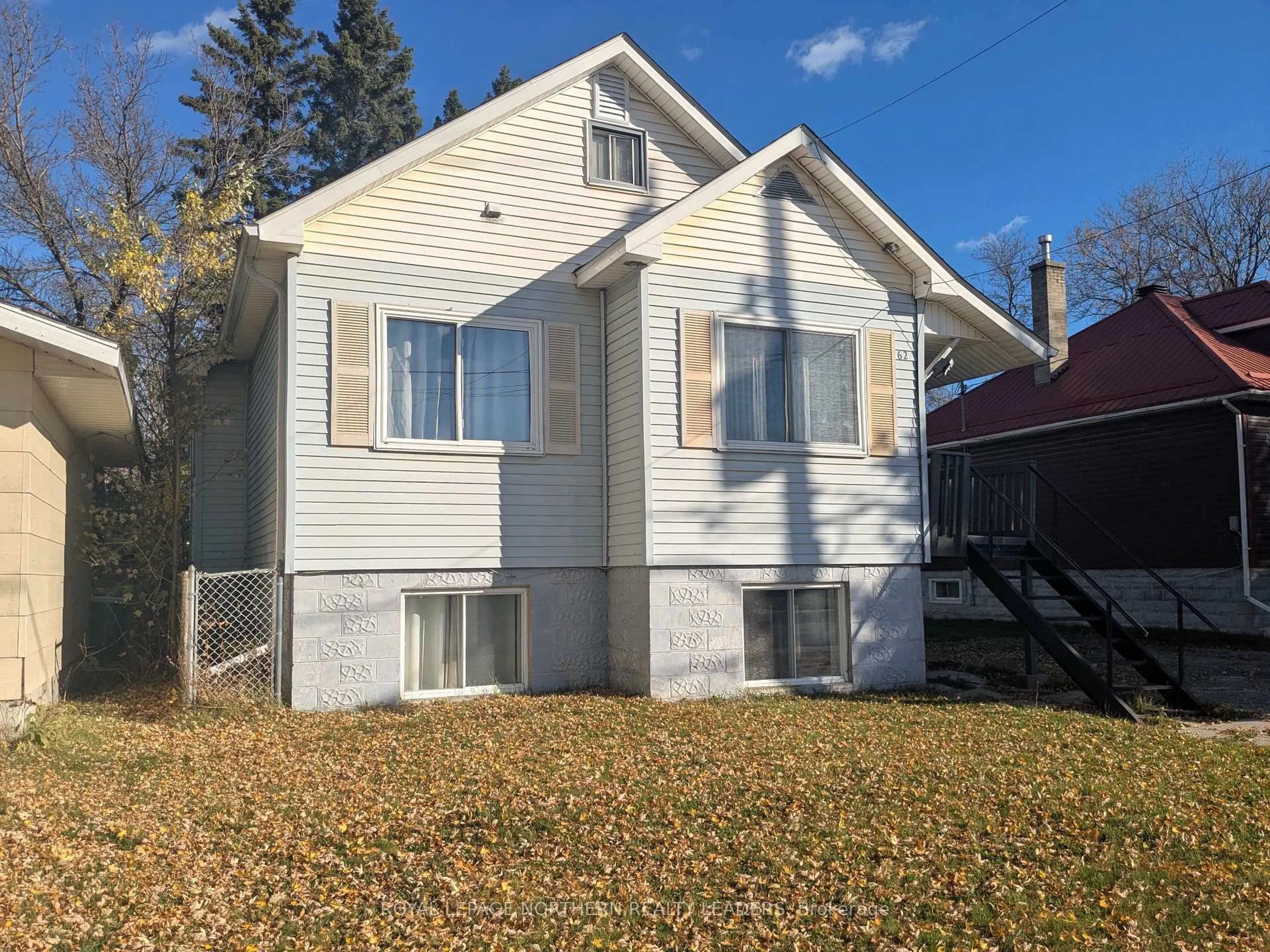 Home with vinyl exterior material, street for 62 Powell Ave, Timmins Ontario P0N 1H0