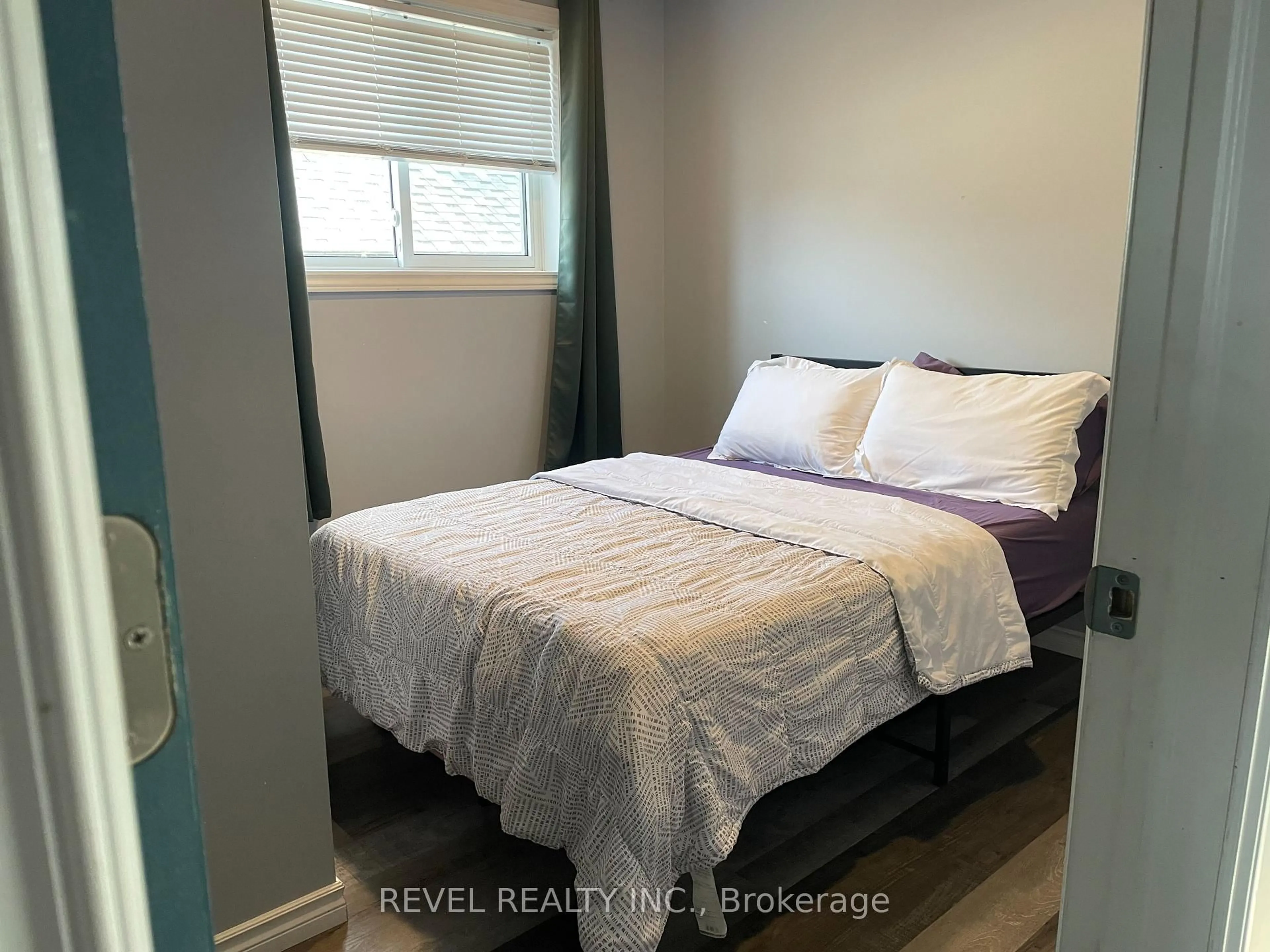 Bedroom with bed, wood/laminate floor for 383 Elm St, Timmins Ontario P4N 1X6