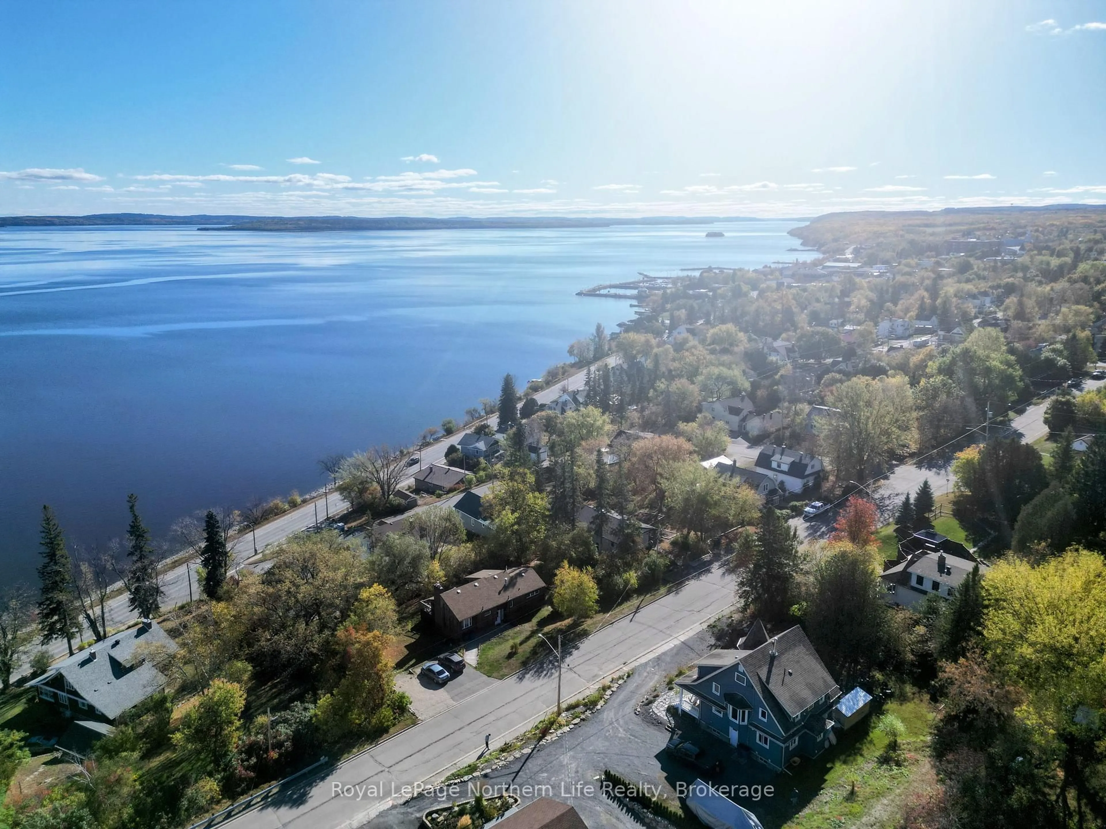 A pic from outside/outdoor area/front of a property/back of a property/a pic from drone, water/lake/river/ocean view for 702 Rorke Ave, Temiskaming Shores Ontario P0J 1K0