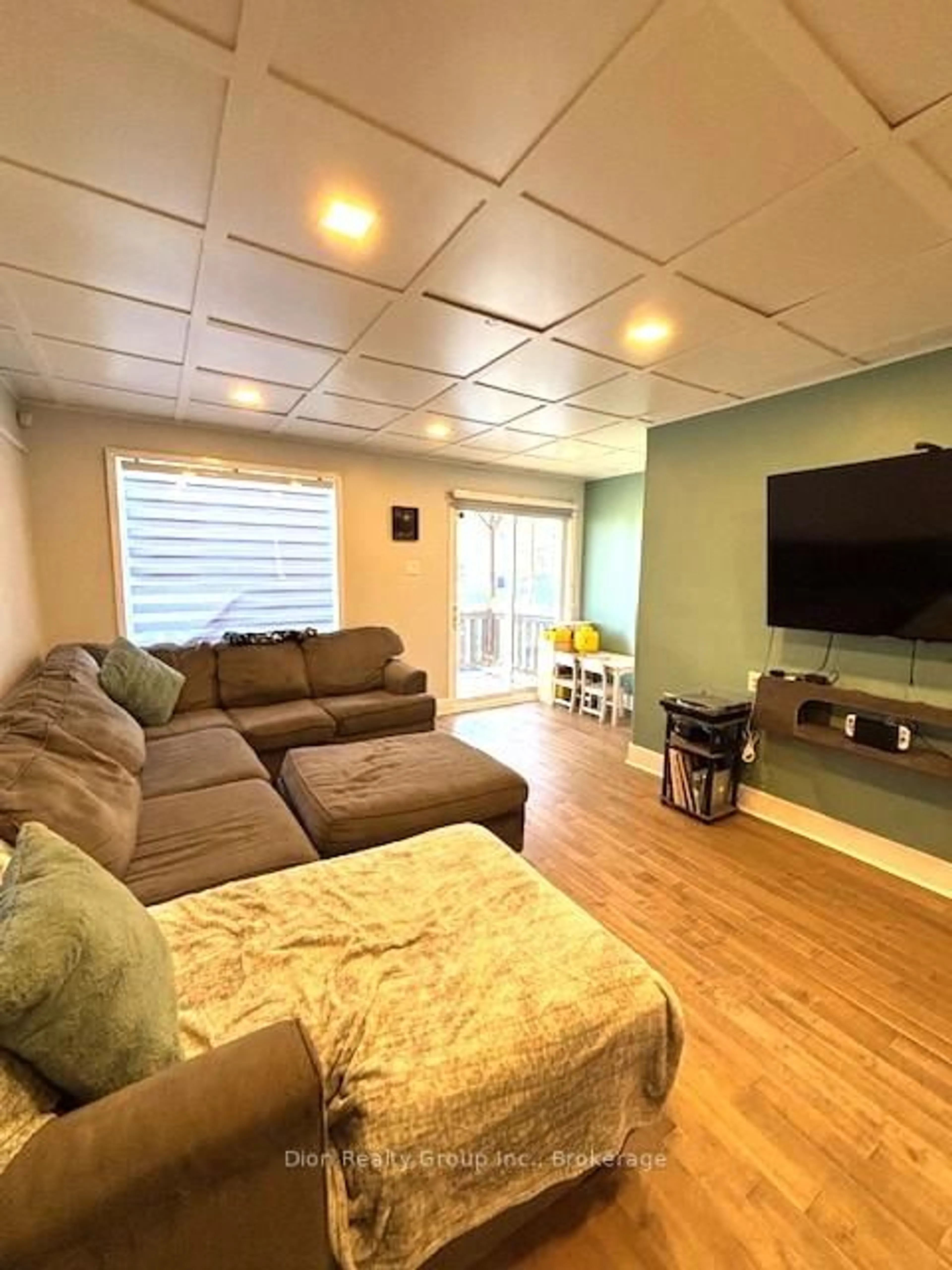 Living room with furniture, wood/laminate floor for 22A Rowan Ave, Kirkland Lake Ontario P2N 2N8