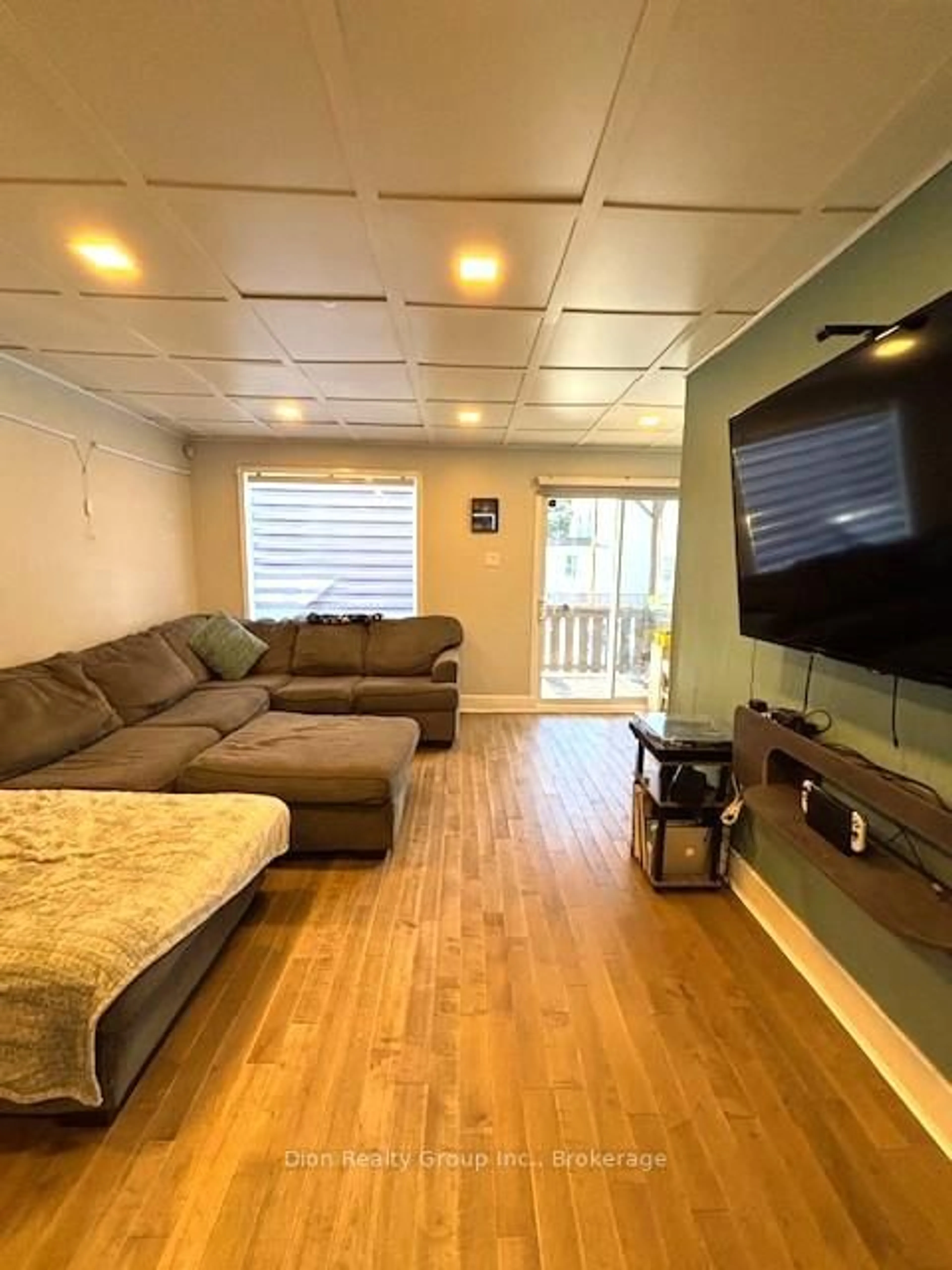 Living room with furniture, wood/laminate floor for 22A Rowan Ave, Kirkland Lake Ontario P2N 2N8