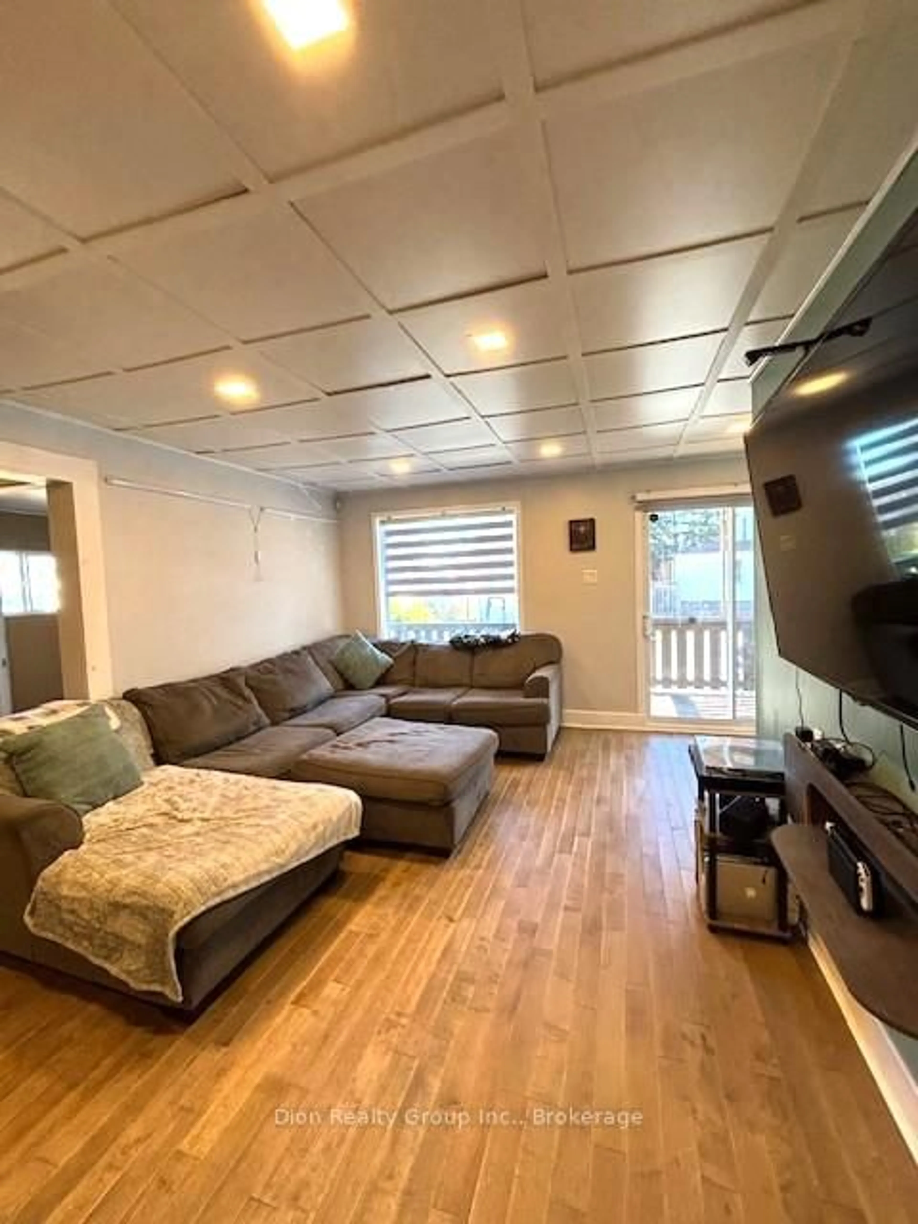 Living room with furniture, wood/laminate floor for 22A Rowan Ave, Kirkland Lake Ontario P2N 2N8