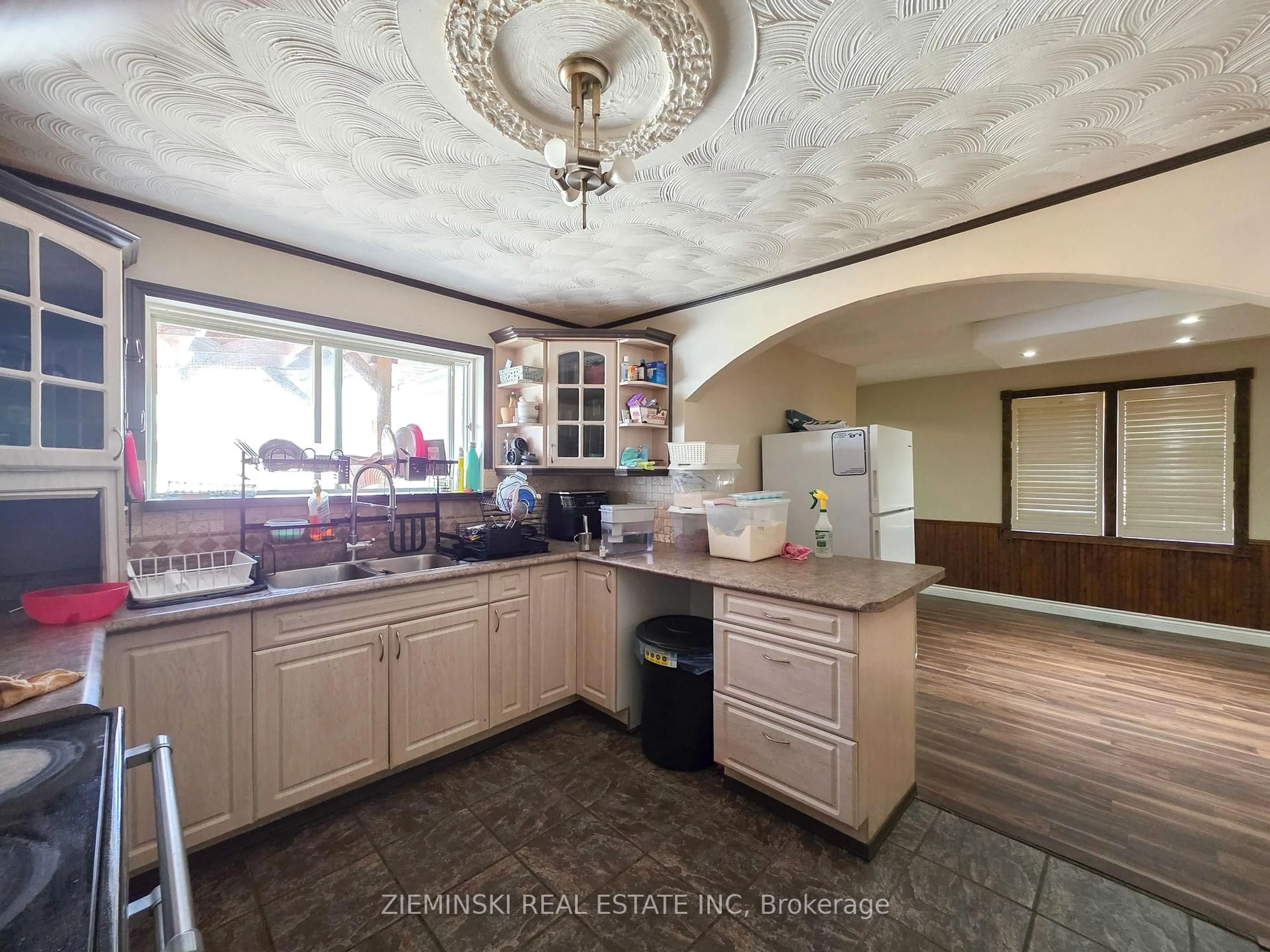 Open concept kitchen, ceramic/tile floor for 210 Commercial Ave, Timmins Ontario P4N 2X4